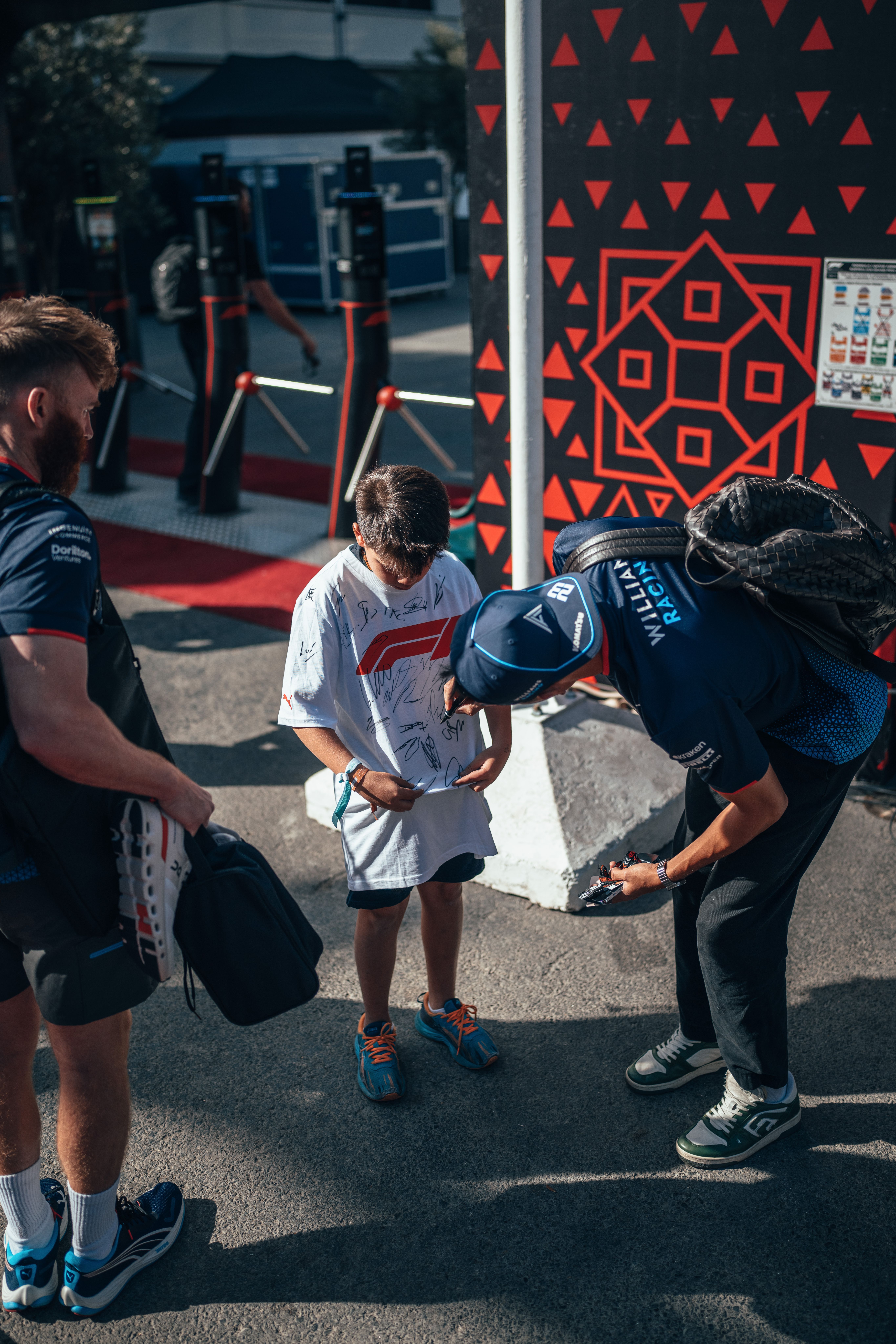 Alex makes a young fan's day as he enters the paddock on Sunday