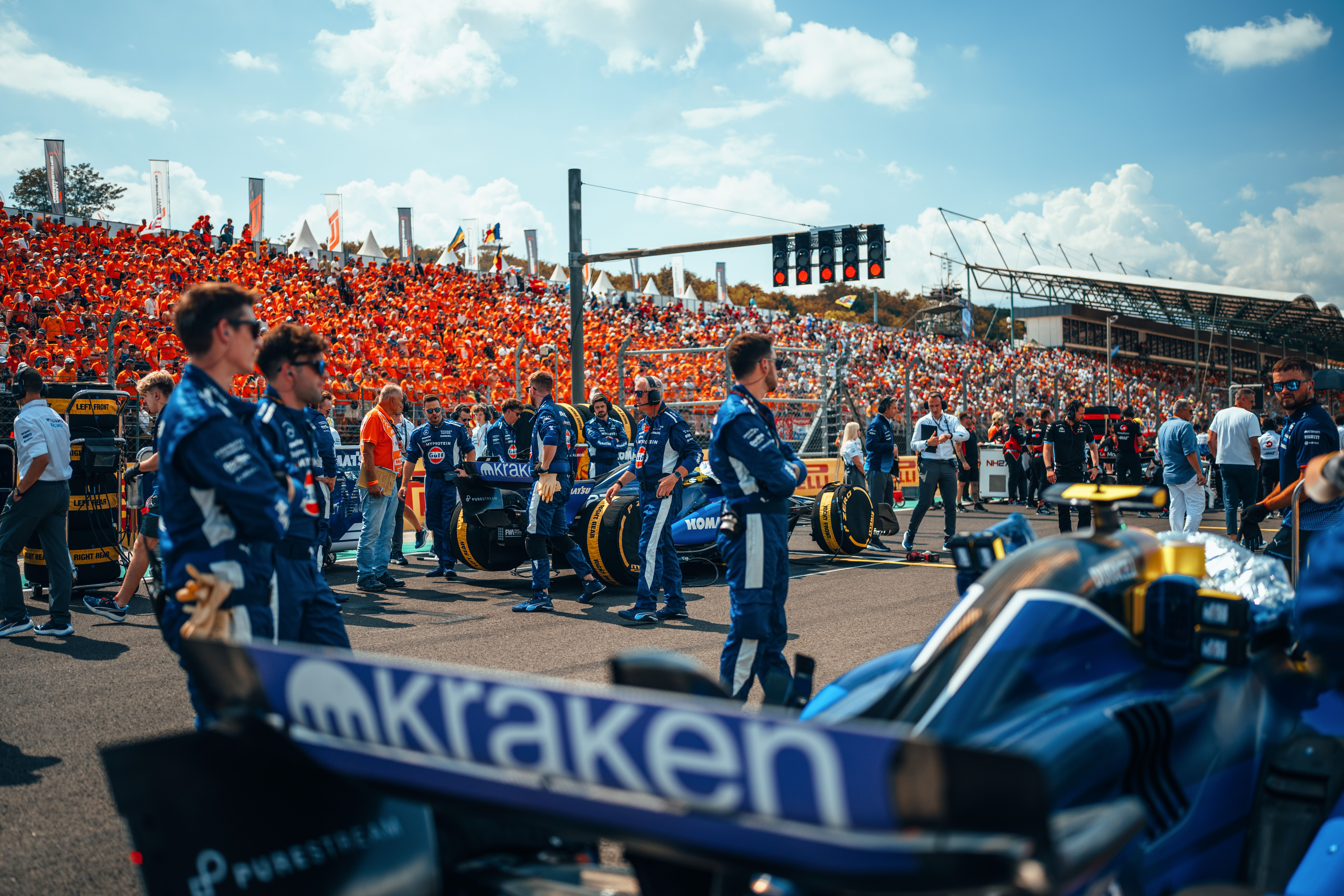Looking down the grid with packed grandstands