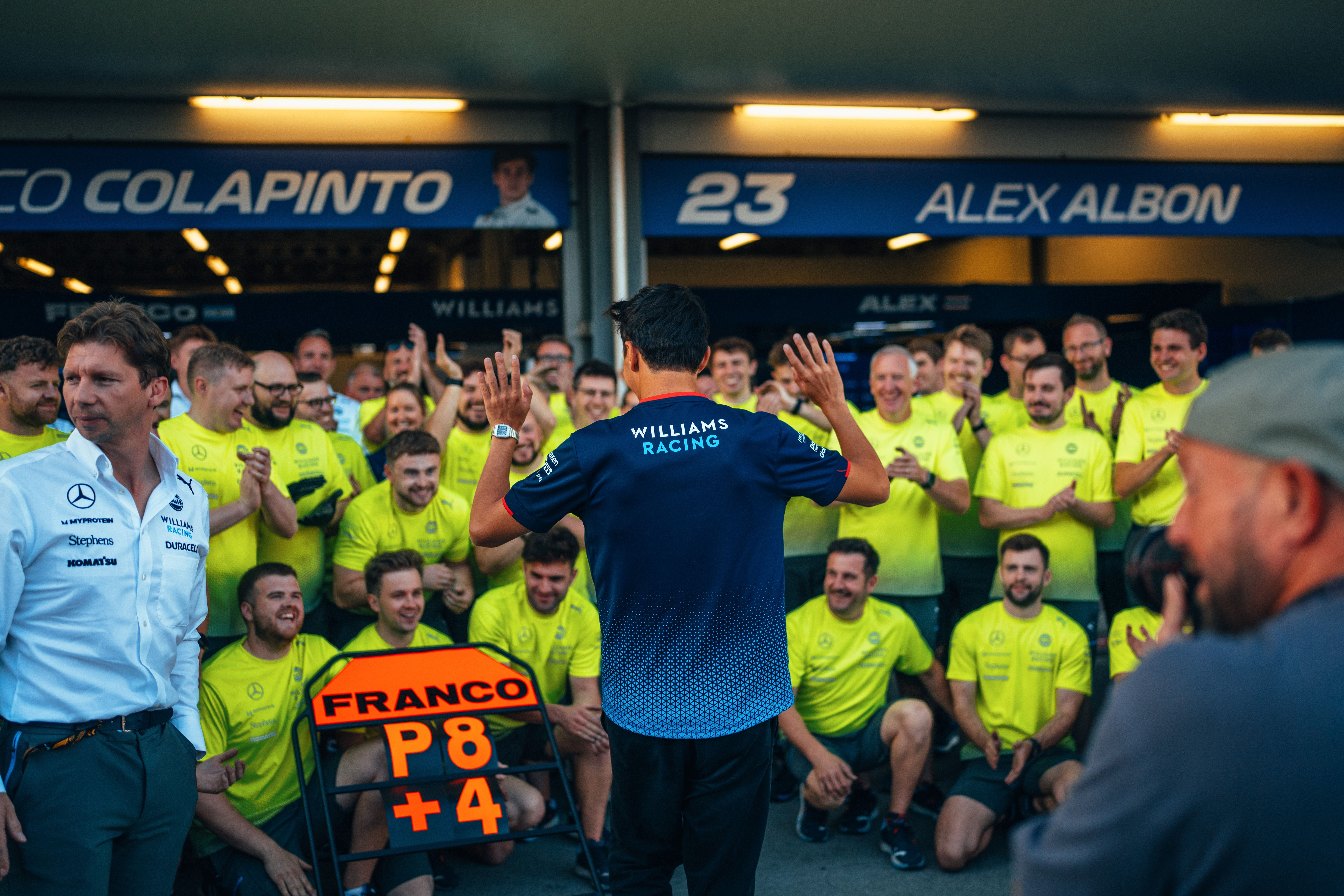 Alex approaches for the celebration photograph