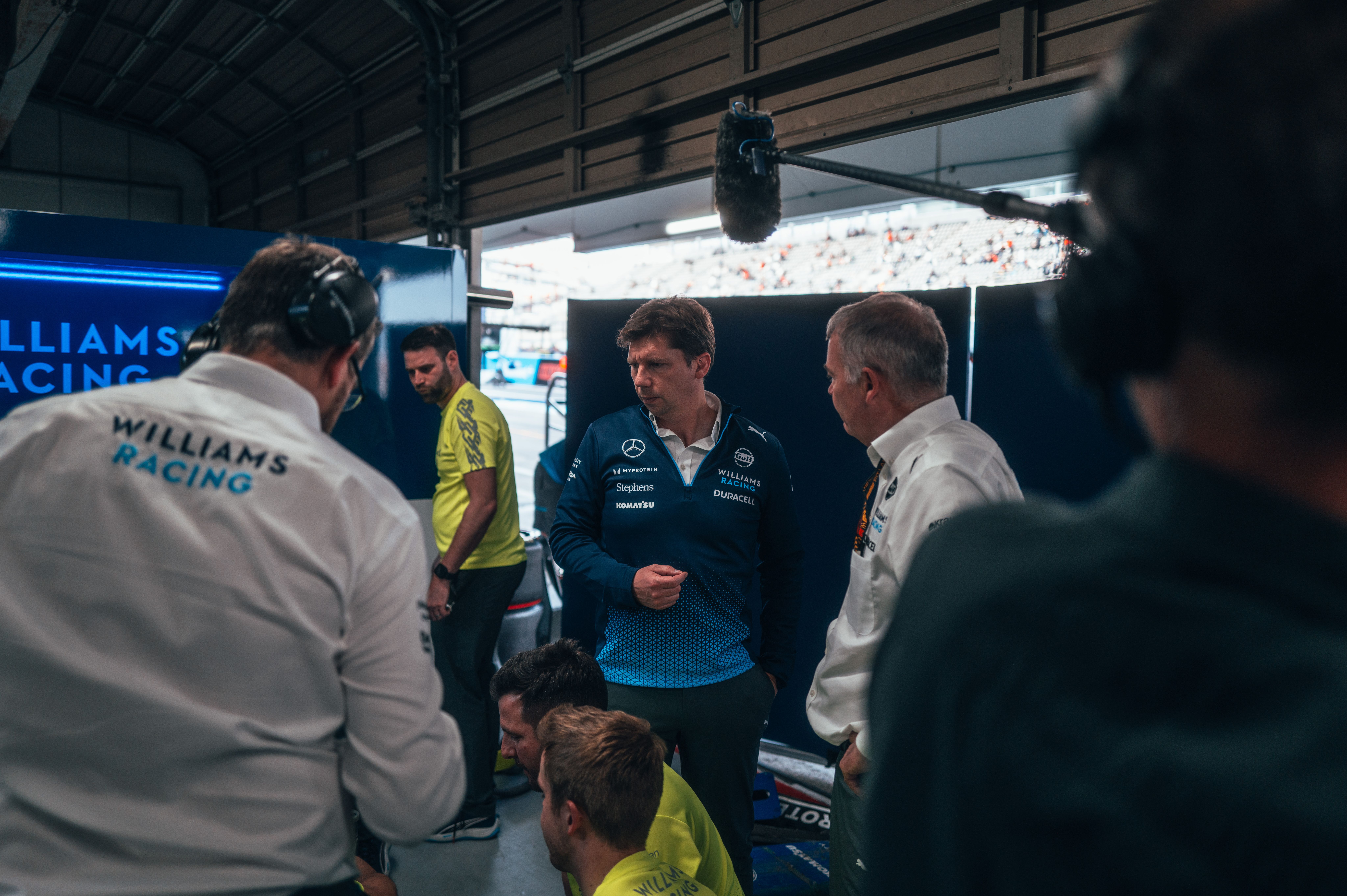 James assesses the damage to Alex's car