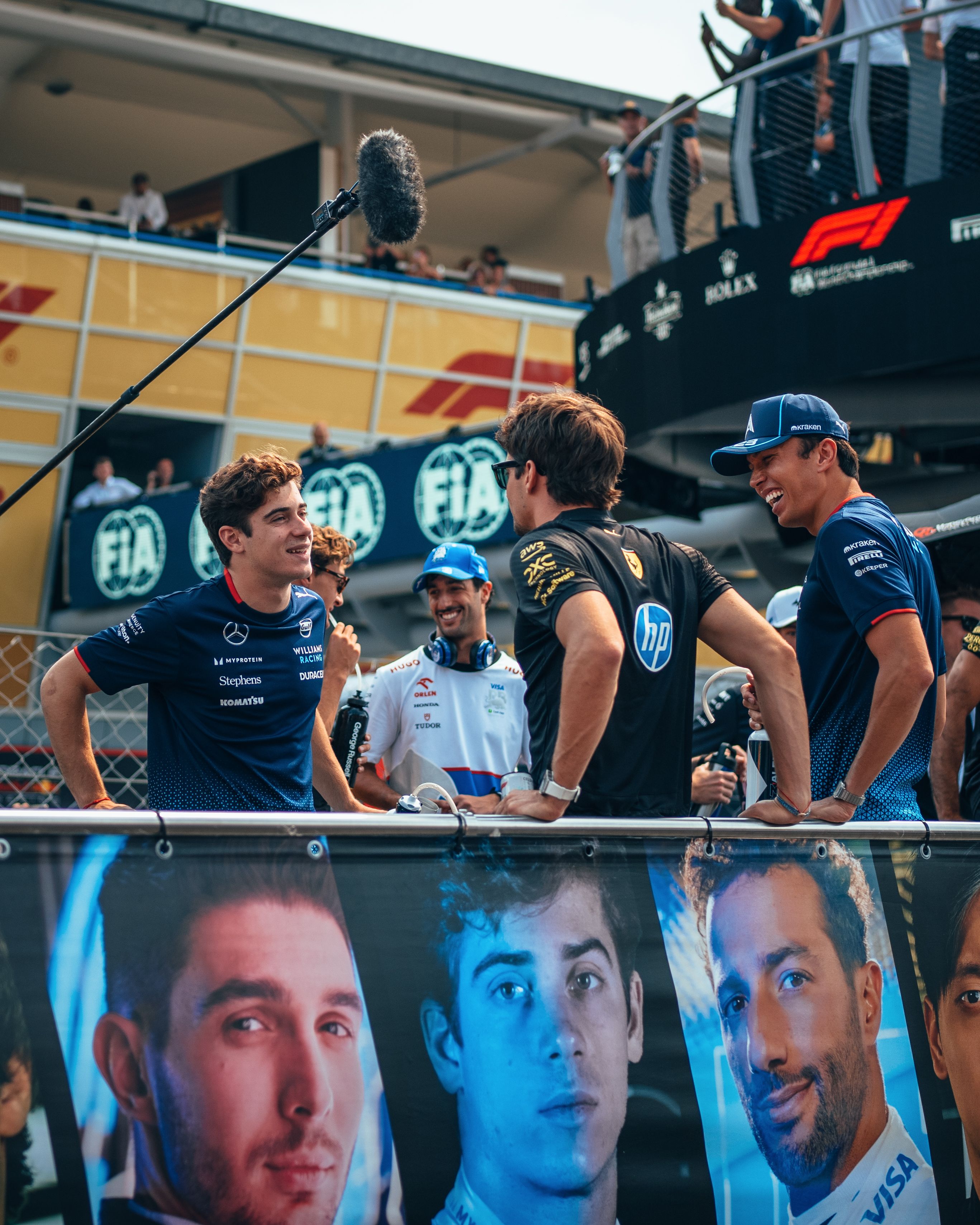 Alex and Franco share a laugh with Charles Leclerc