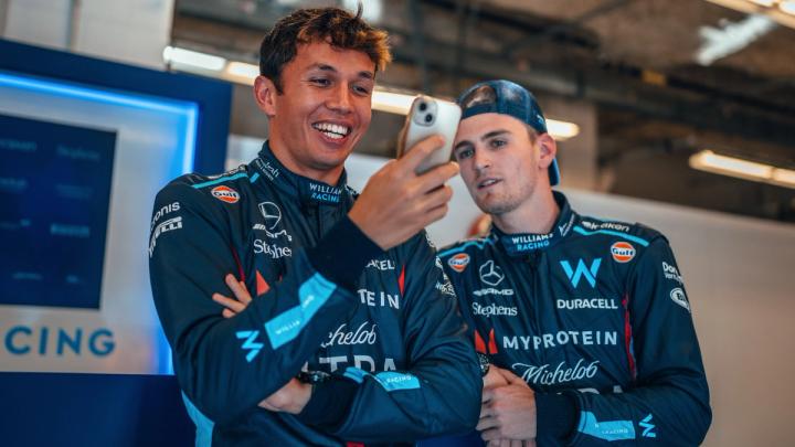 Alex Albon and Logan Sargeant Williams Racing Drivers in F1 on their phone