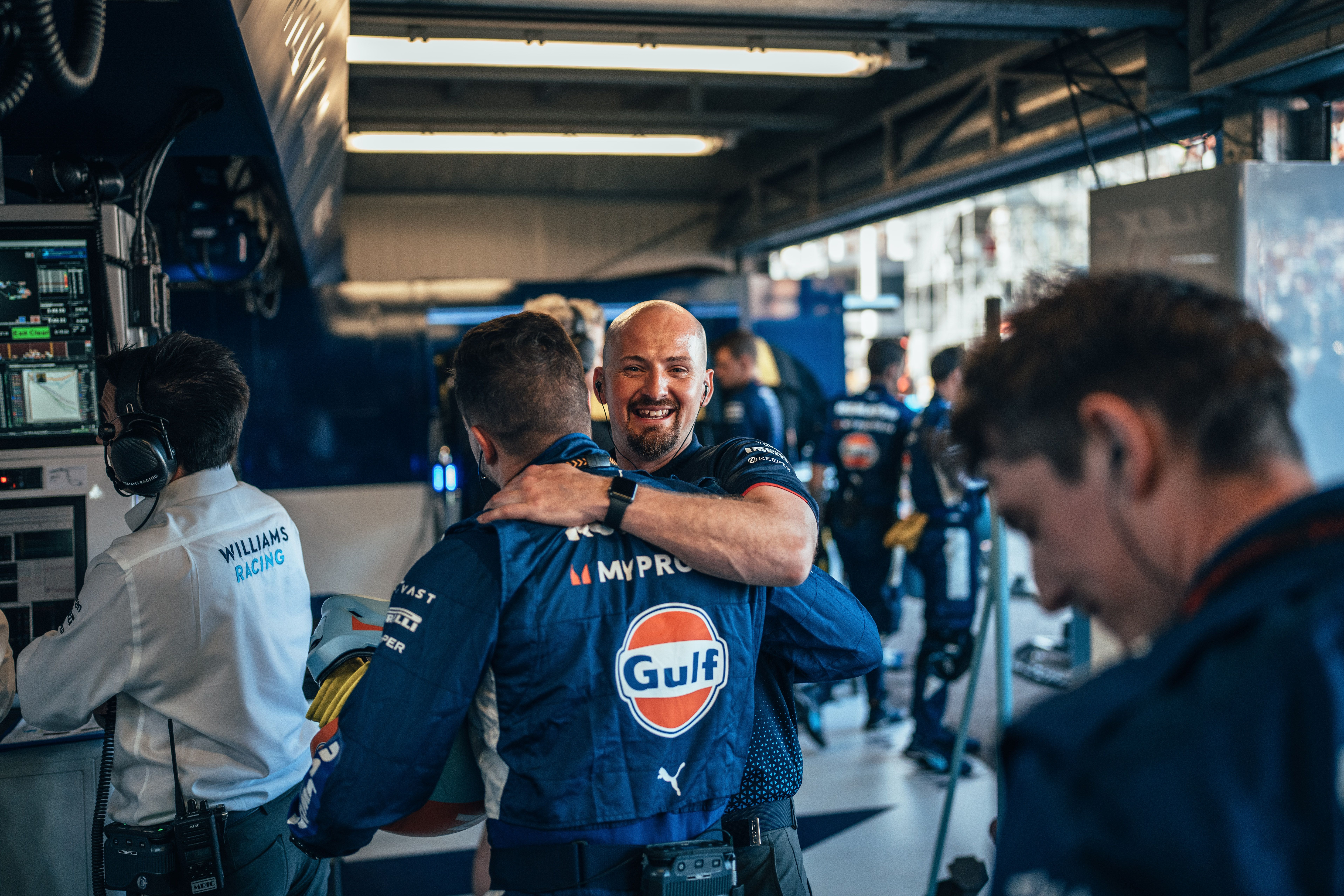 The happiness radiates around the garage after Alex's P9 finish