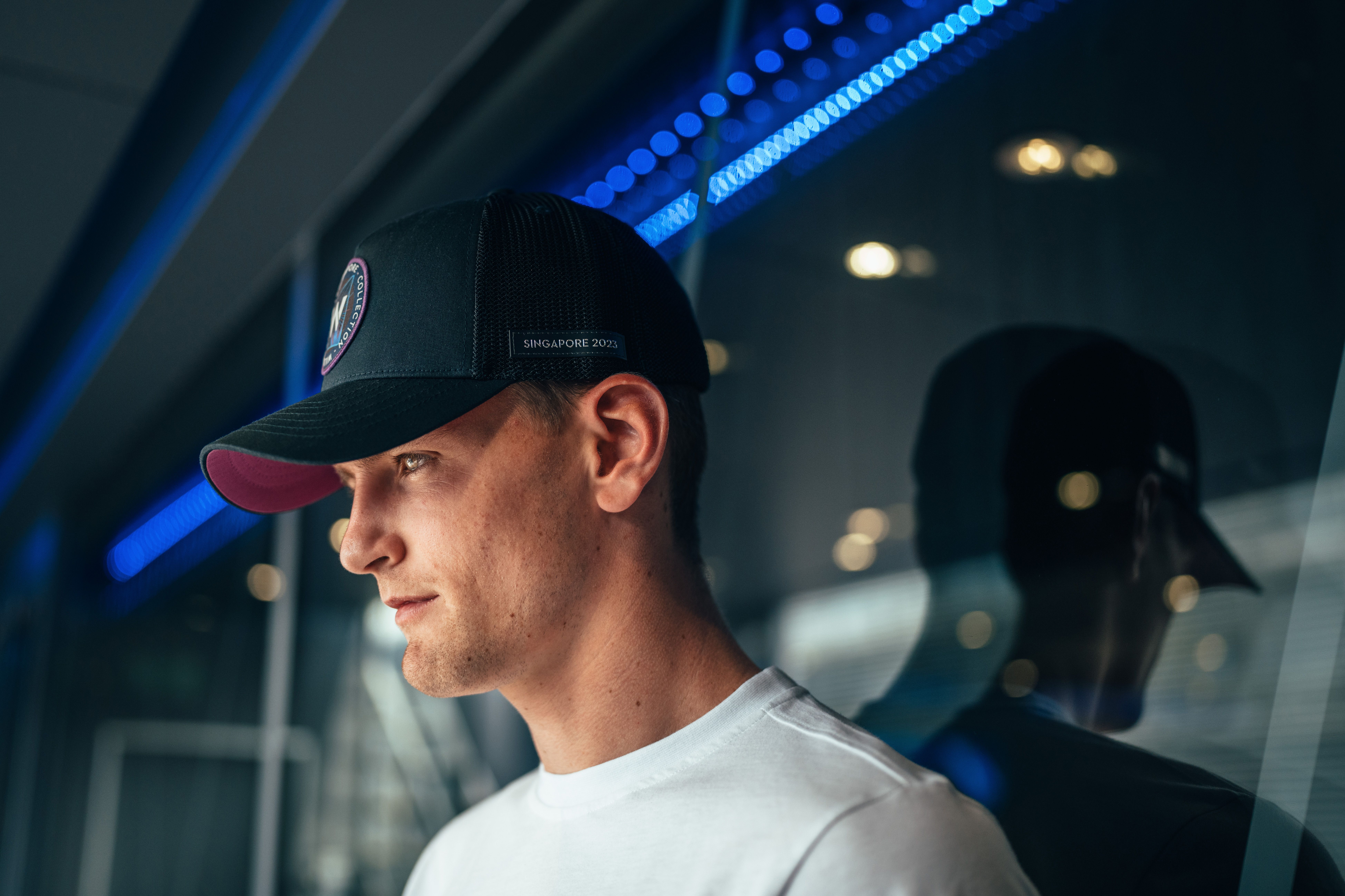 The Trucker Cap goes perfectly with both the black and the white tee.