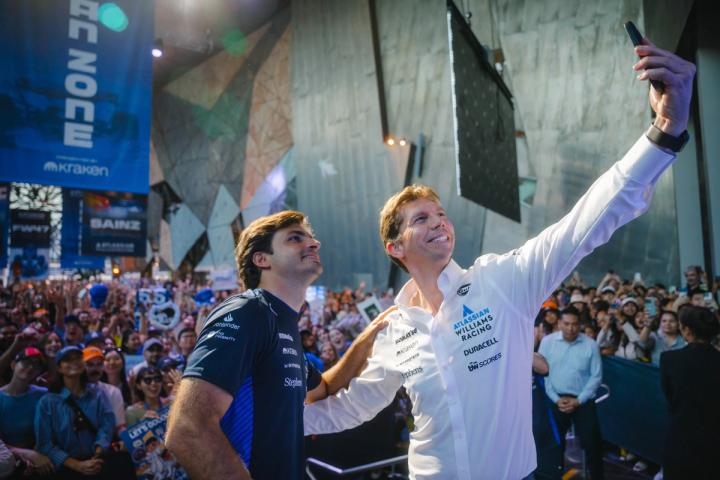 James Vowles and Carlos Sainz taking a selfie in front of a crowd of Williams fans