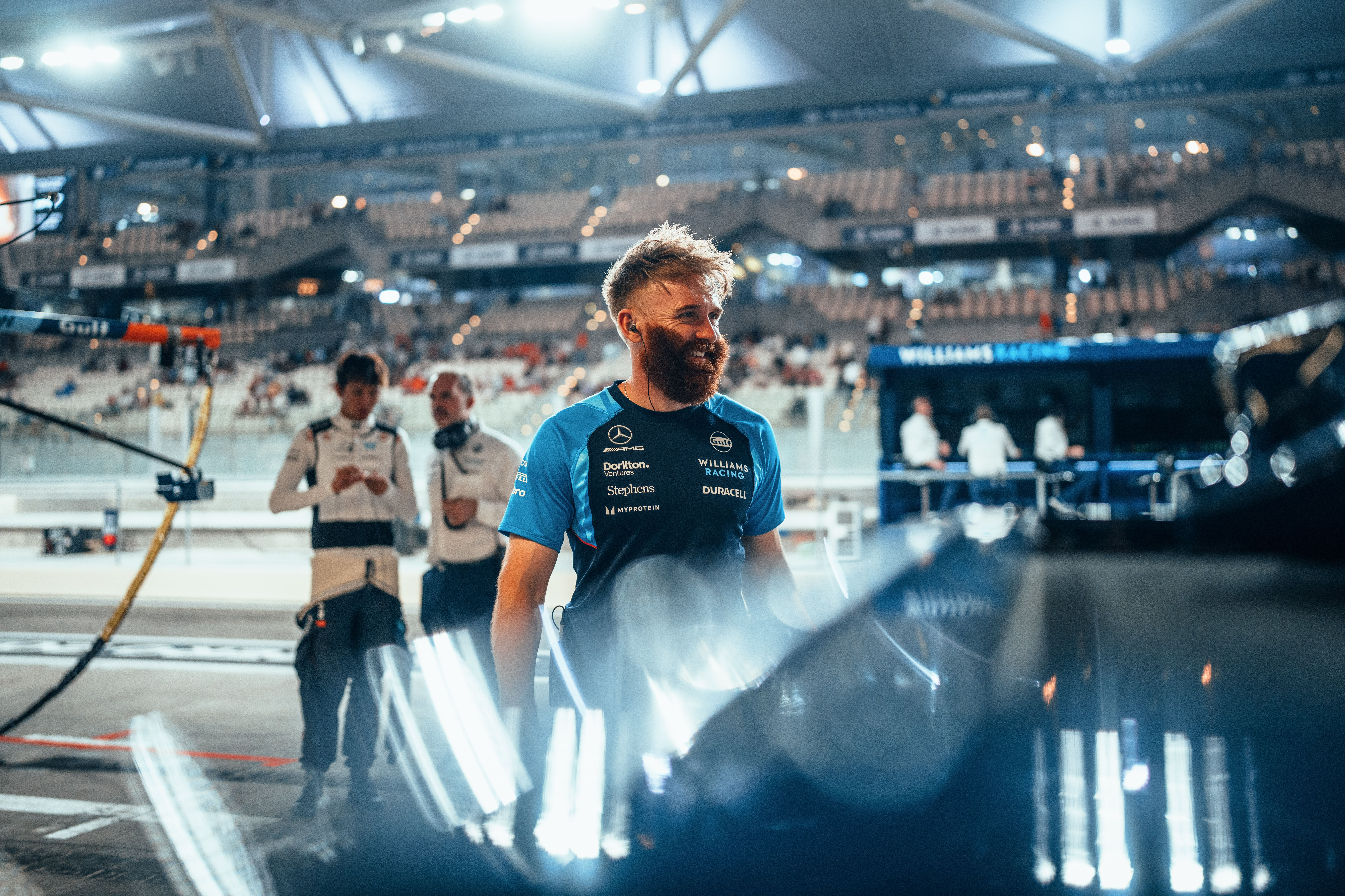 Patrick enjoys a moment in the pit lane as Alex and James Urwin chat about the upcoming session.