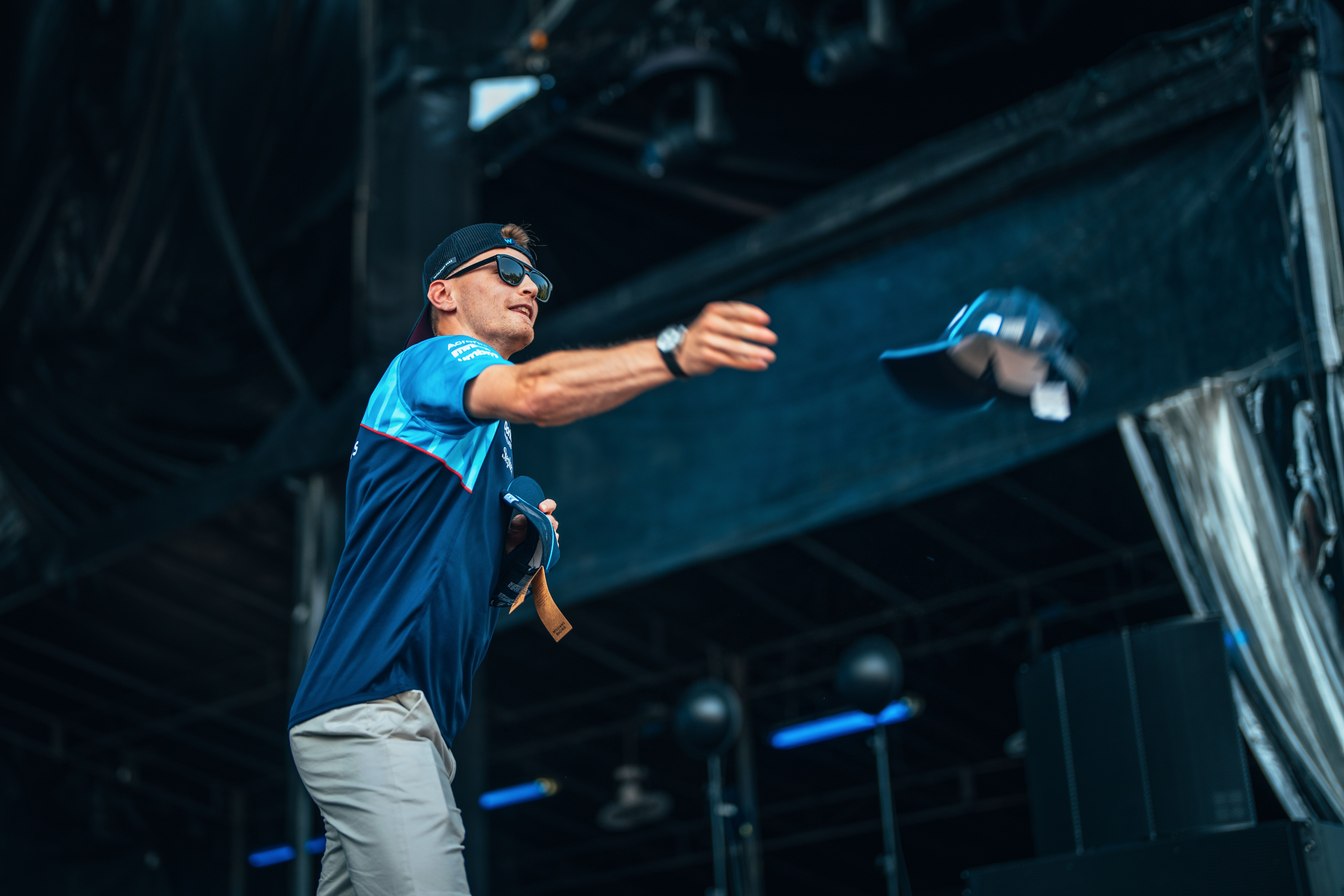 Another cap for another fan when Logan throws one down from the stage.