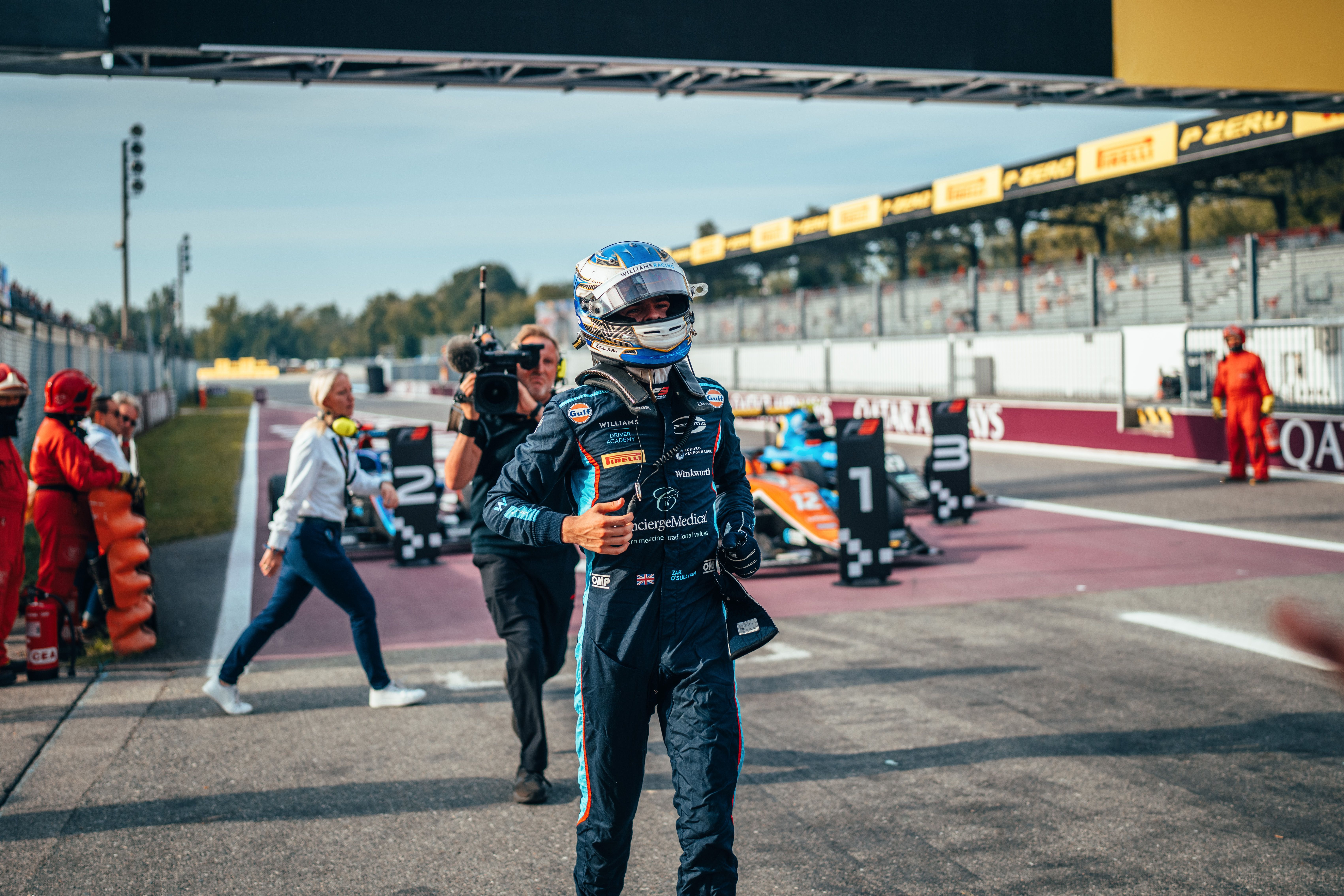 Zak runs over to celebrate with the team after his hard-fought Feature Race P2.