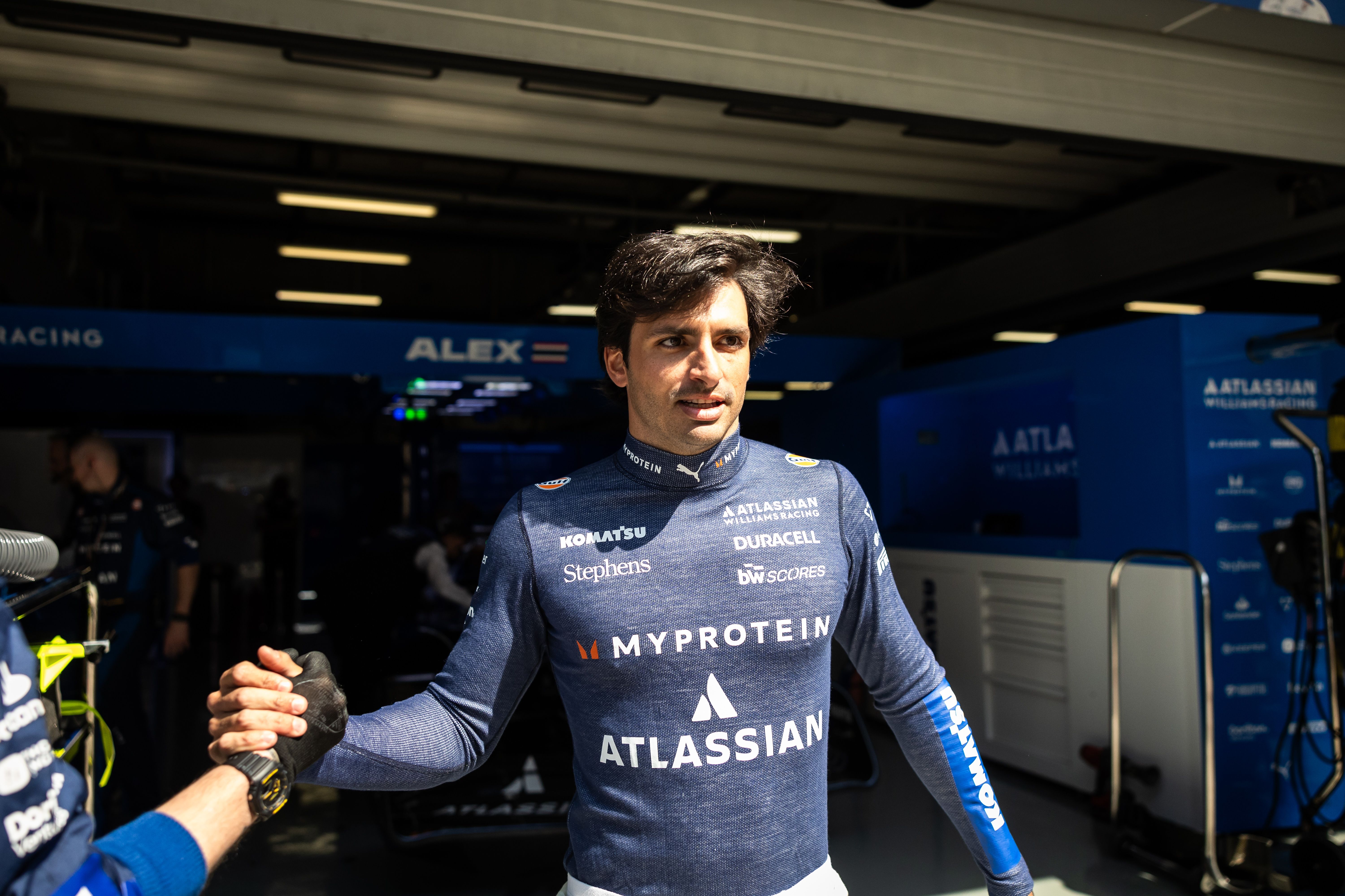 A handshake from Carlos for the pit crew