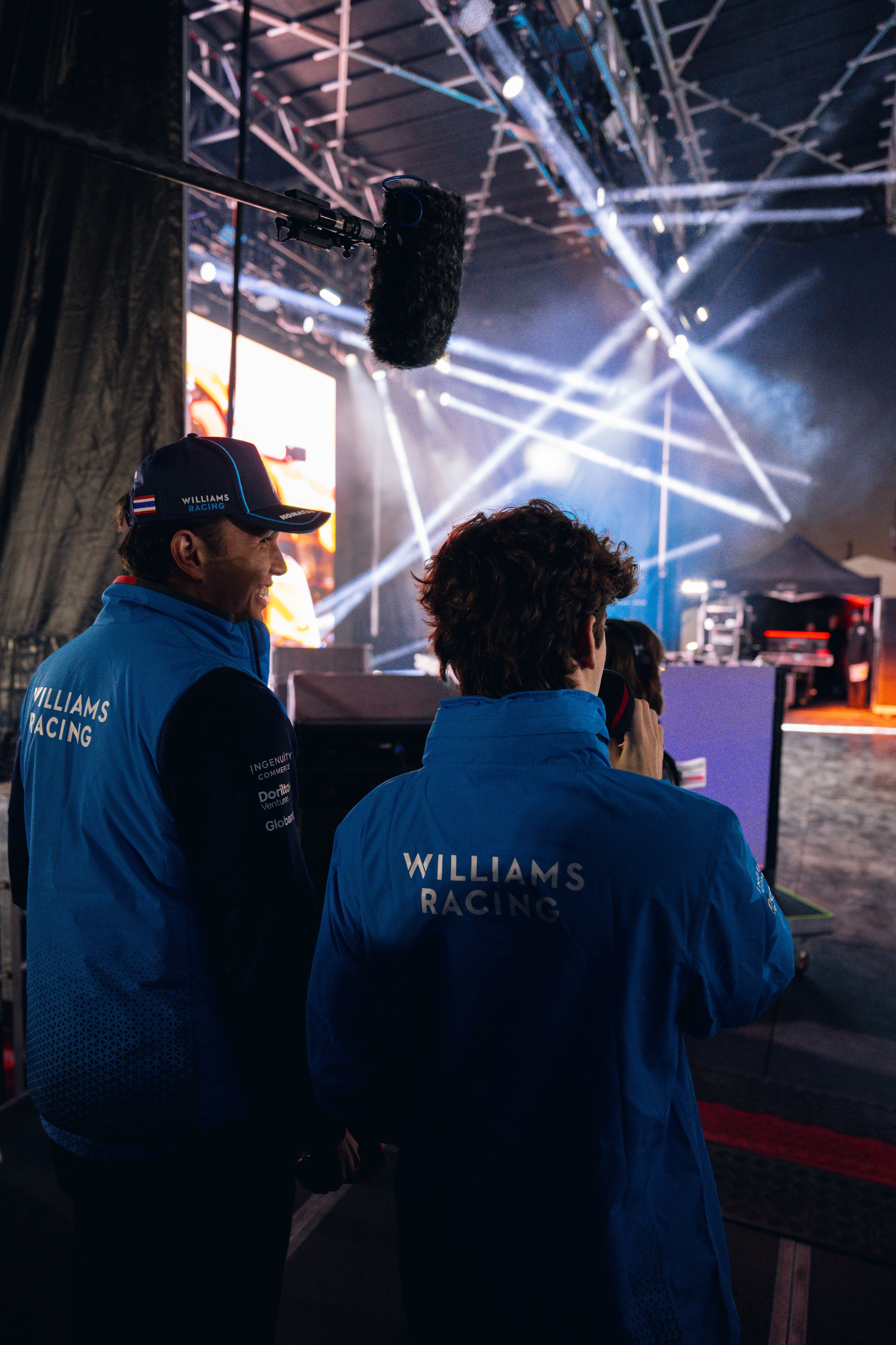 Taking to the stage.