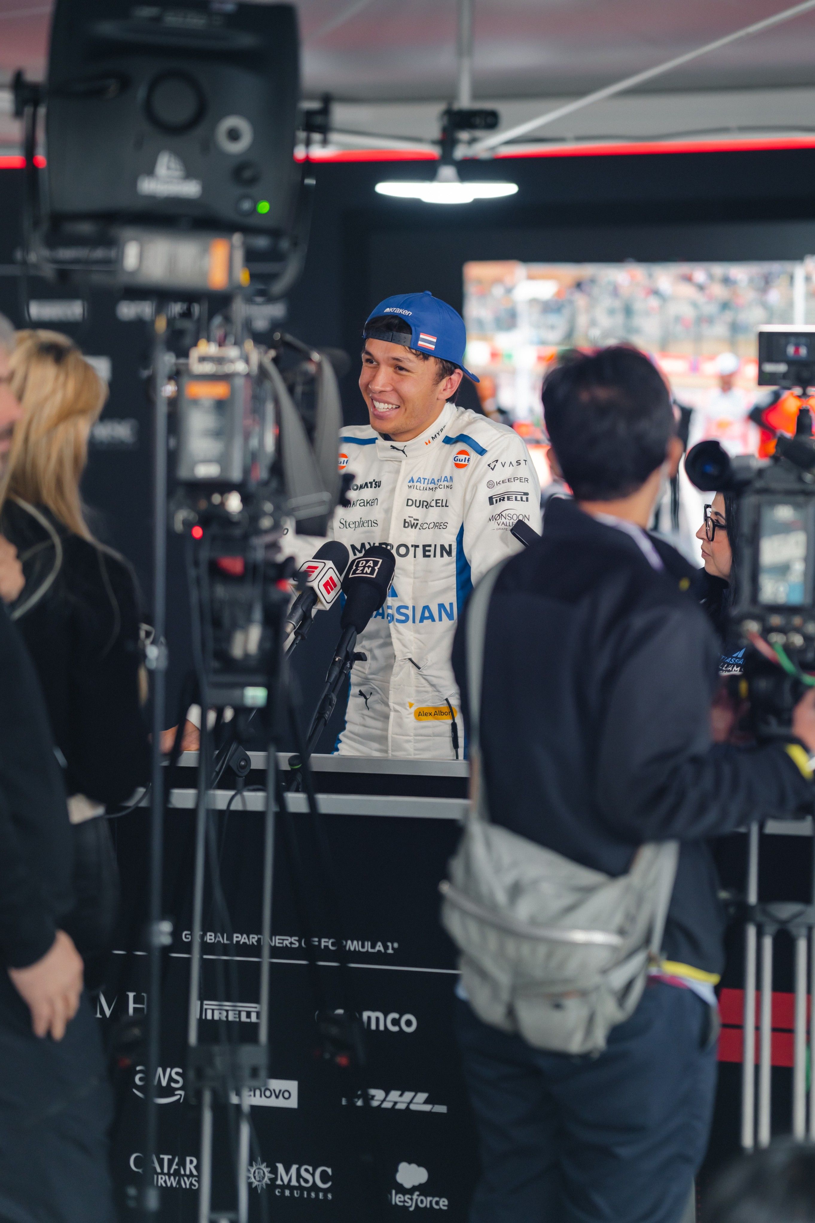 All smiles in the media pen.