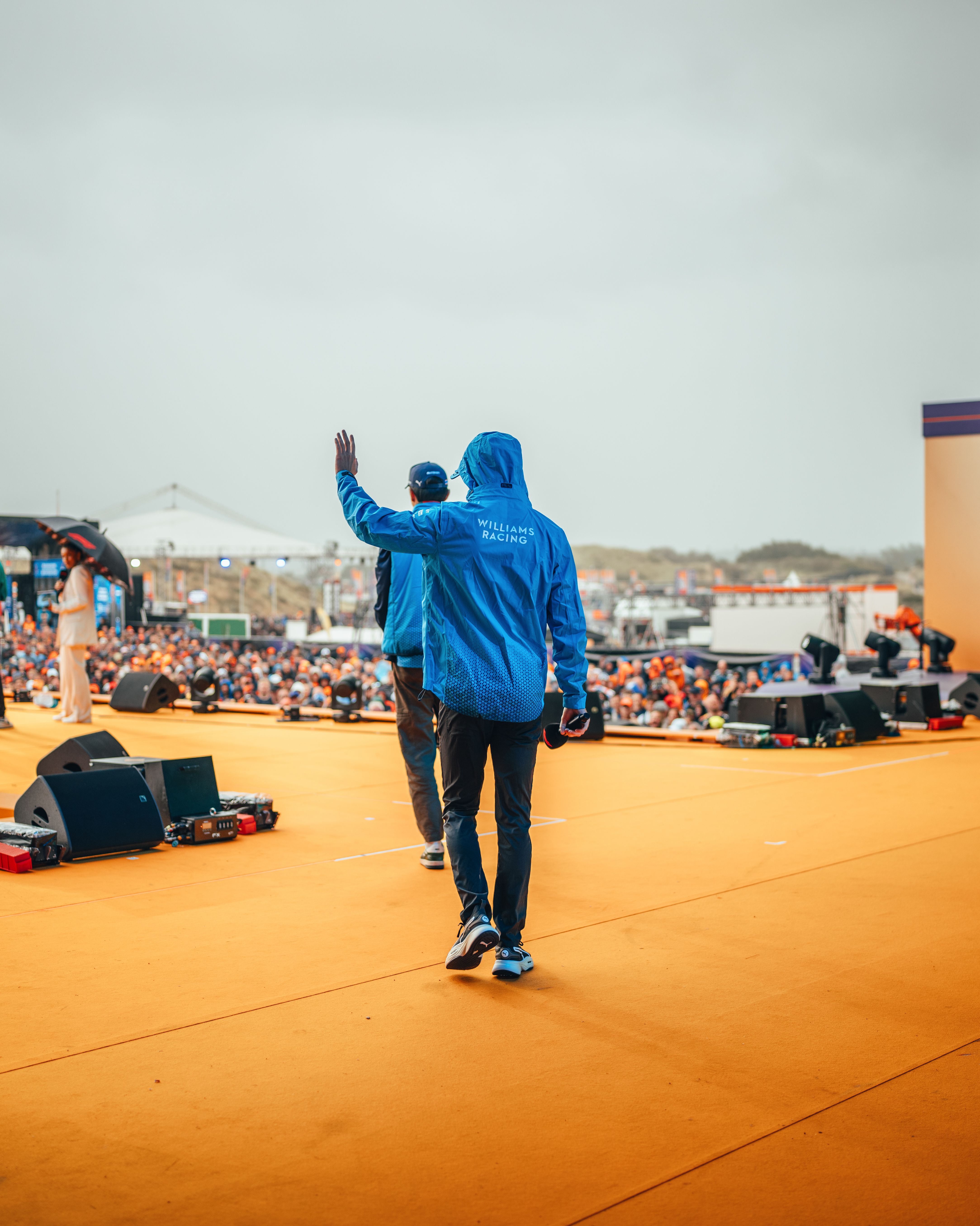 Taking to the stage.