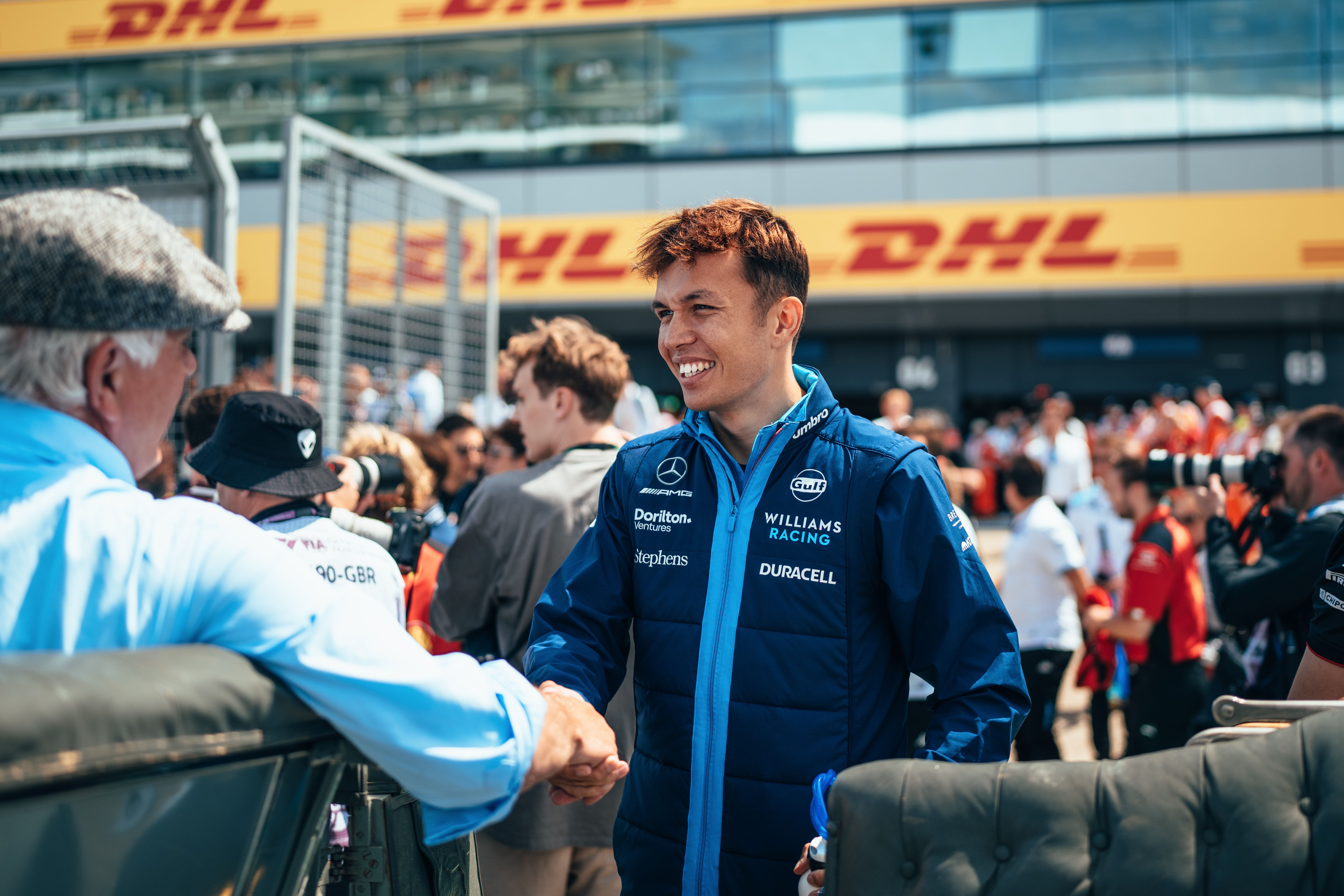 Meeting the person who will take him on his first lap of the day.