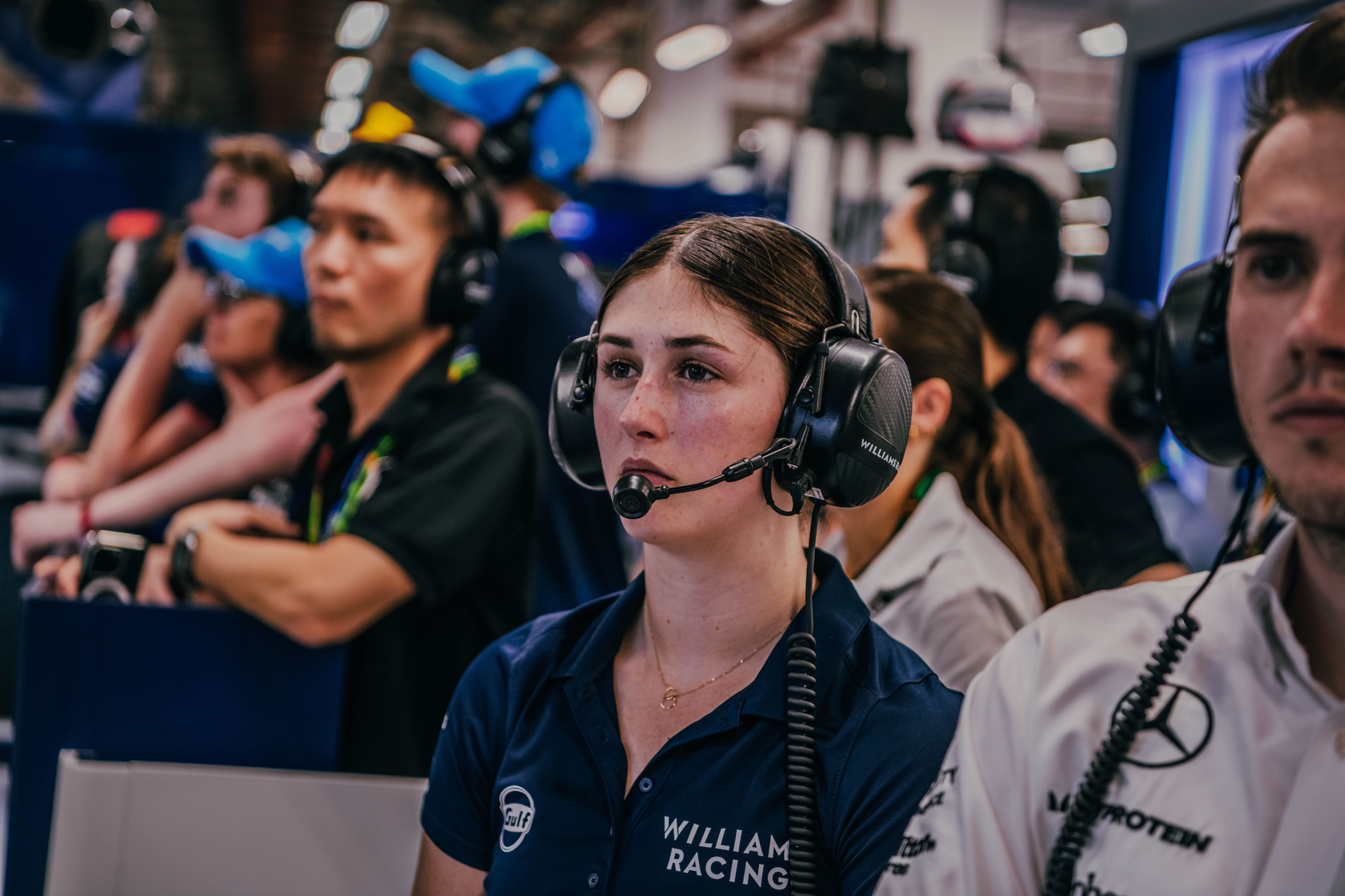 Lia watches on from the garage.