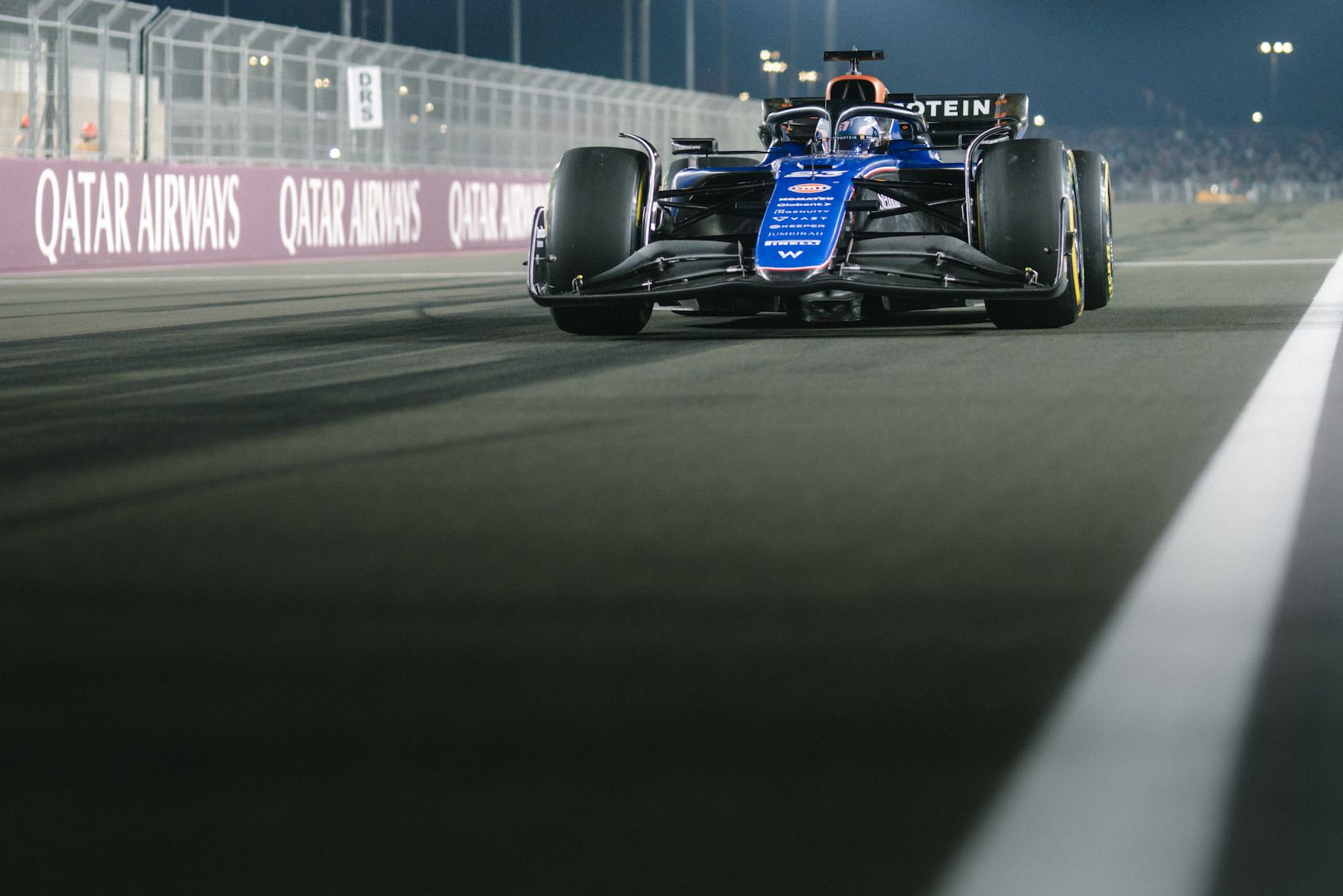 Alex heads down the pit straight.