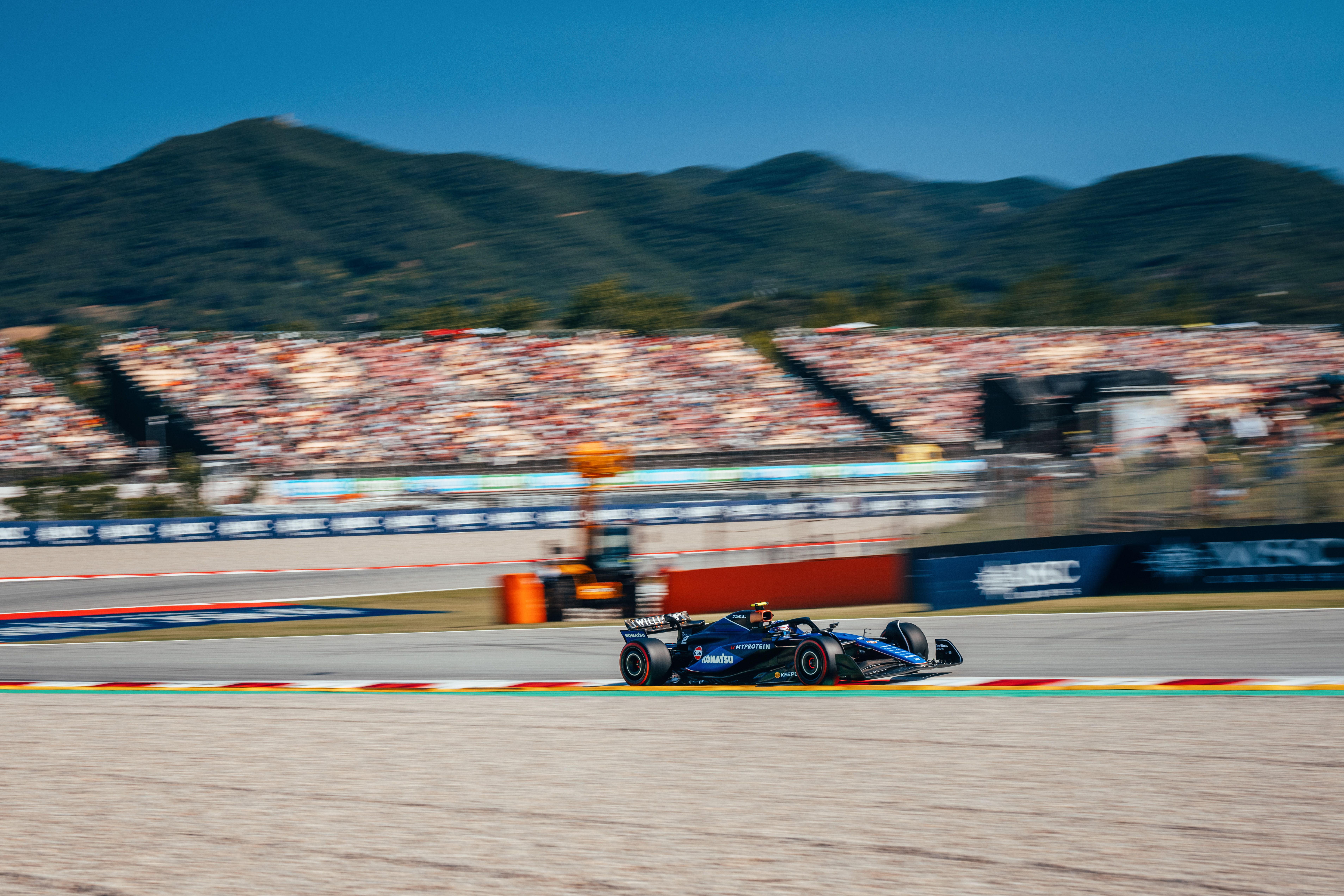 Leaning on the kerbs.