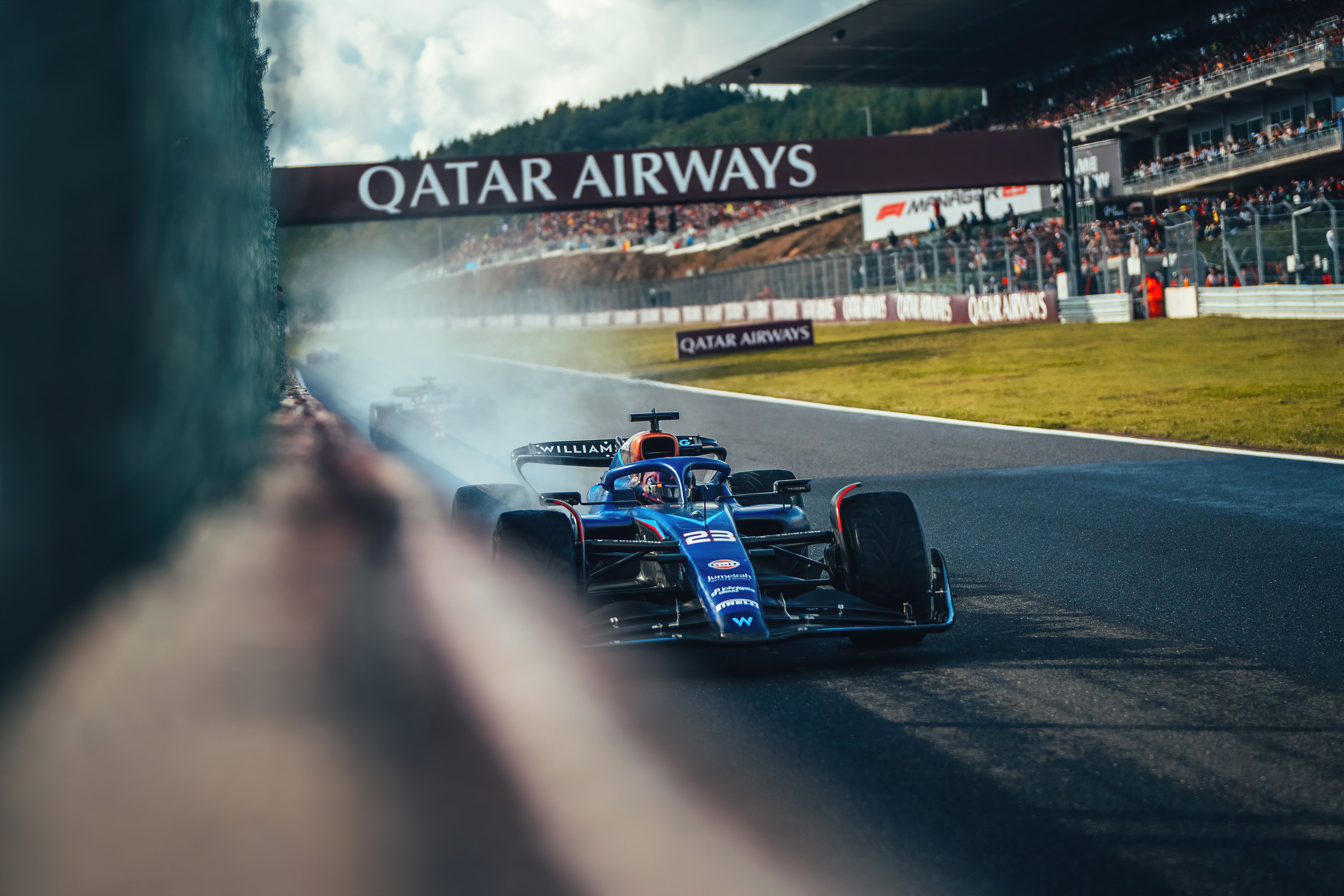 Alex gets close to the wall with Valtteri tucked up behind.