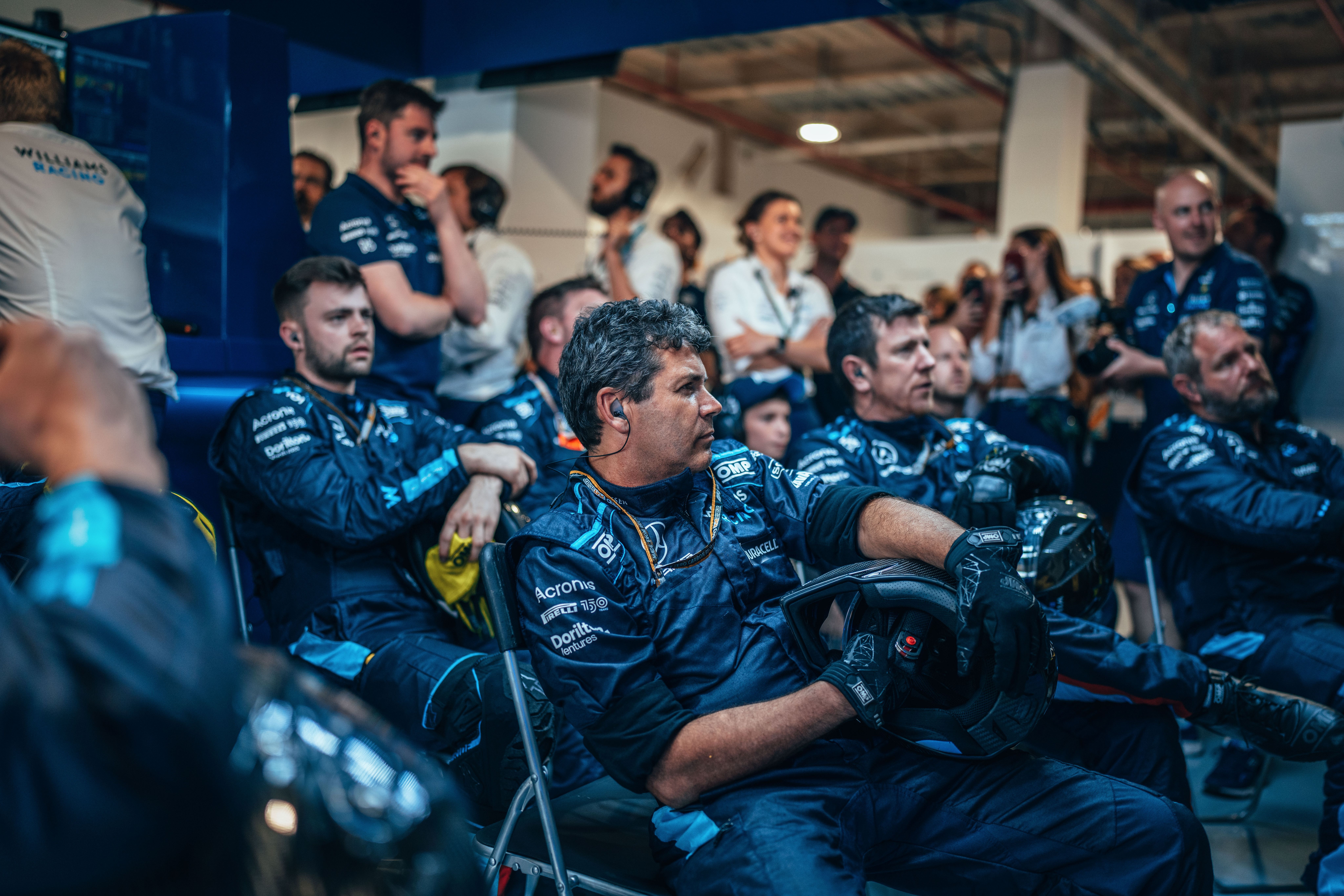 The team watch on intently