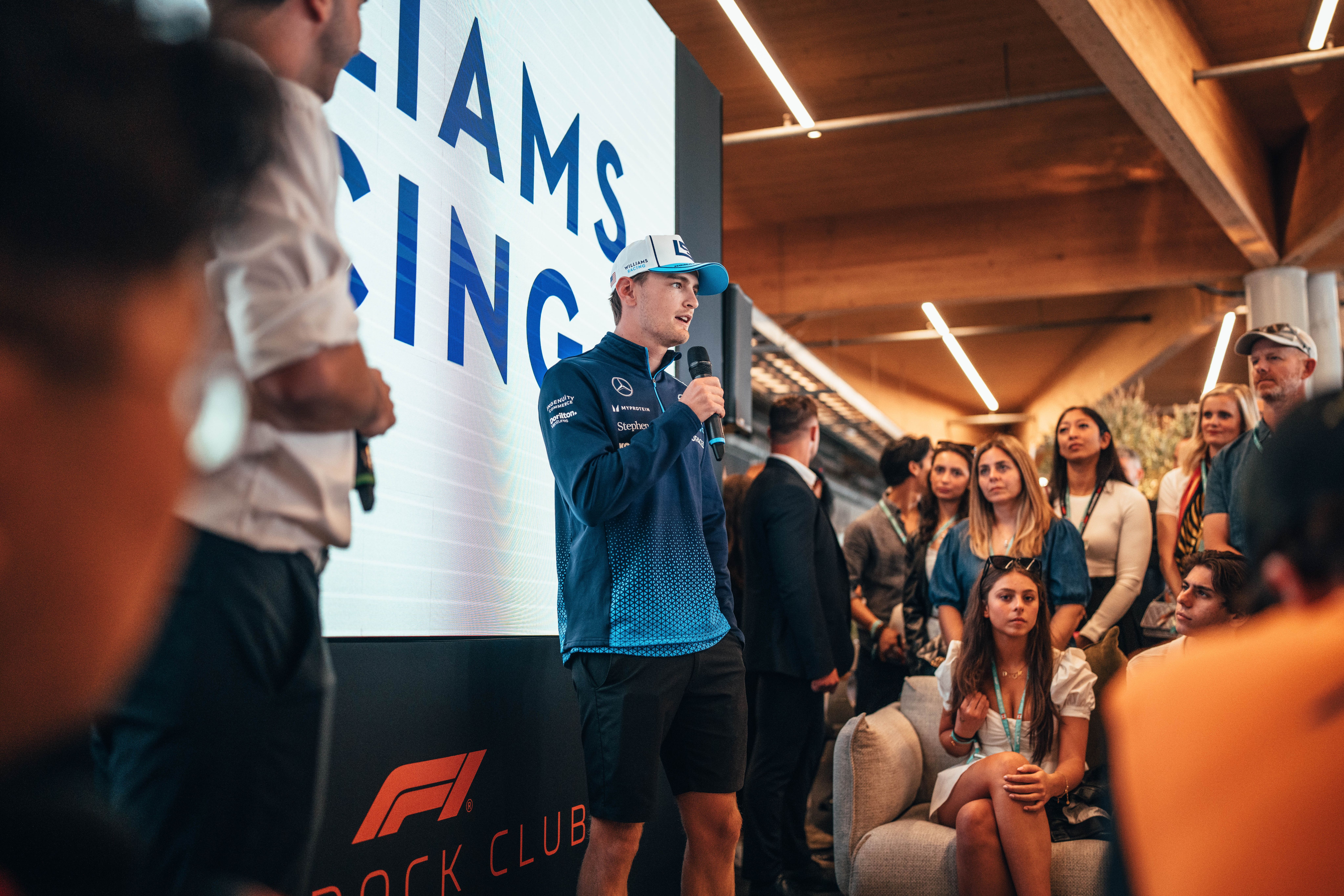 But before he gets in the car, it's up to Paddock Club.