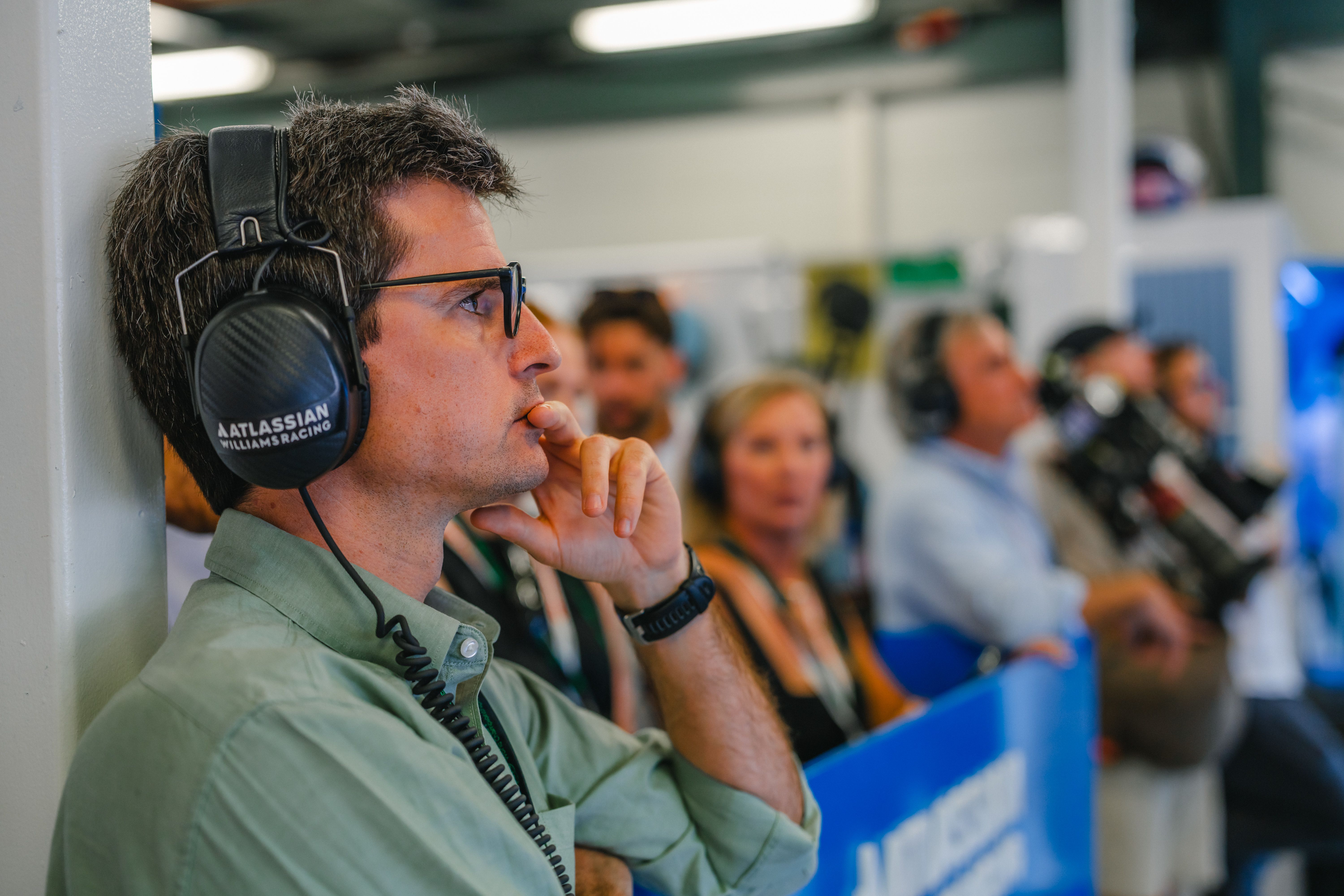 Carlos Oñoro watches on from the garage