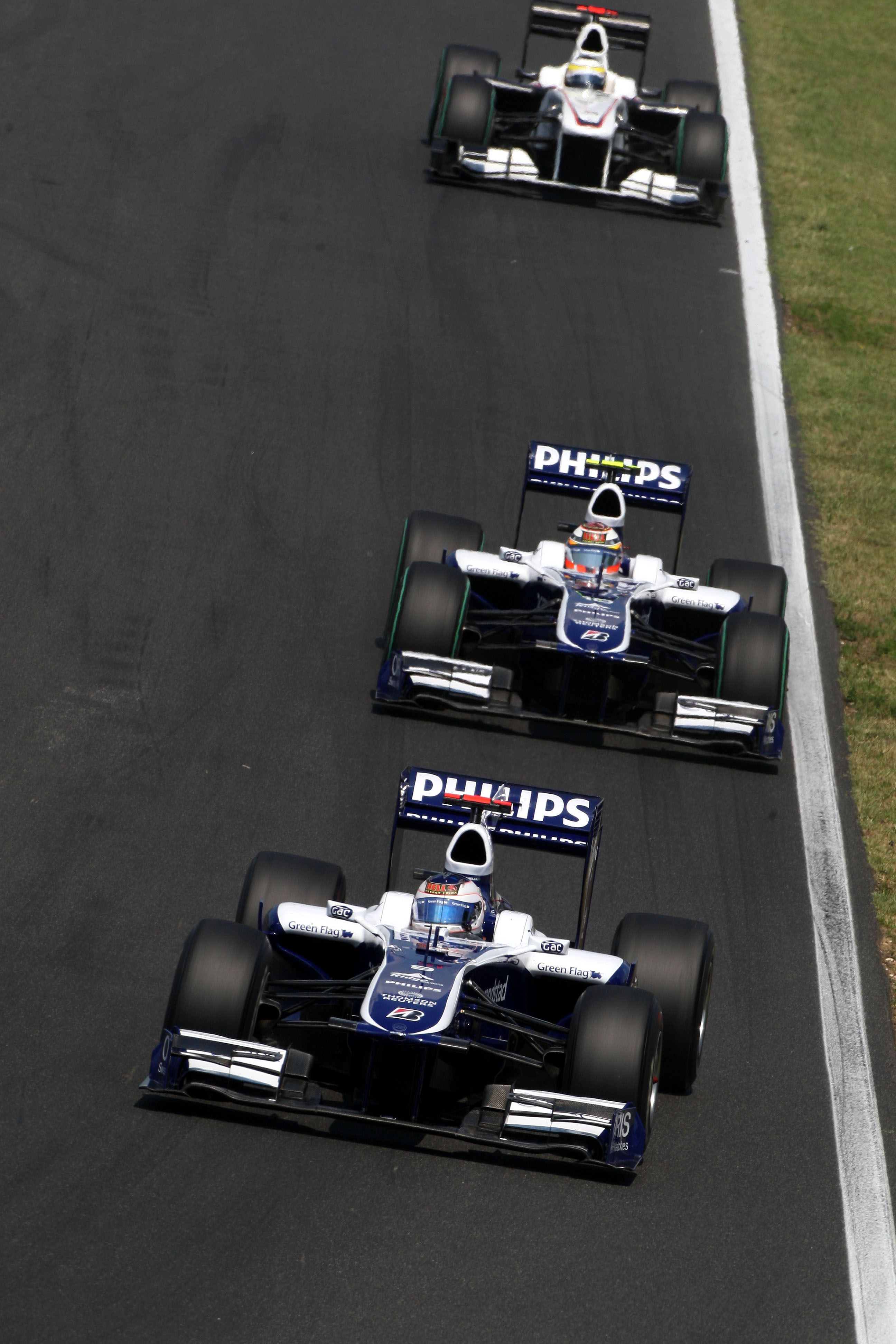 Rubens Barrichello leads Nico Hulkenberg in 2010, but the pair would finish P10 and P6.
