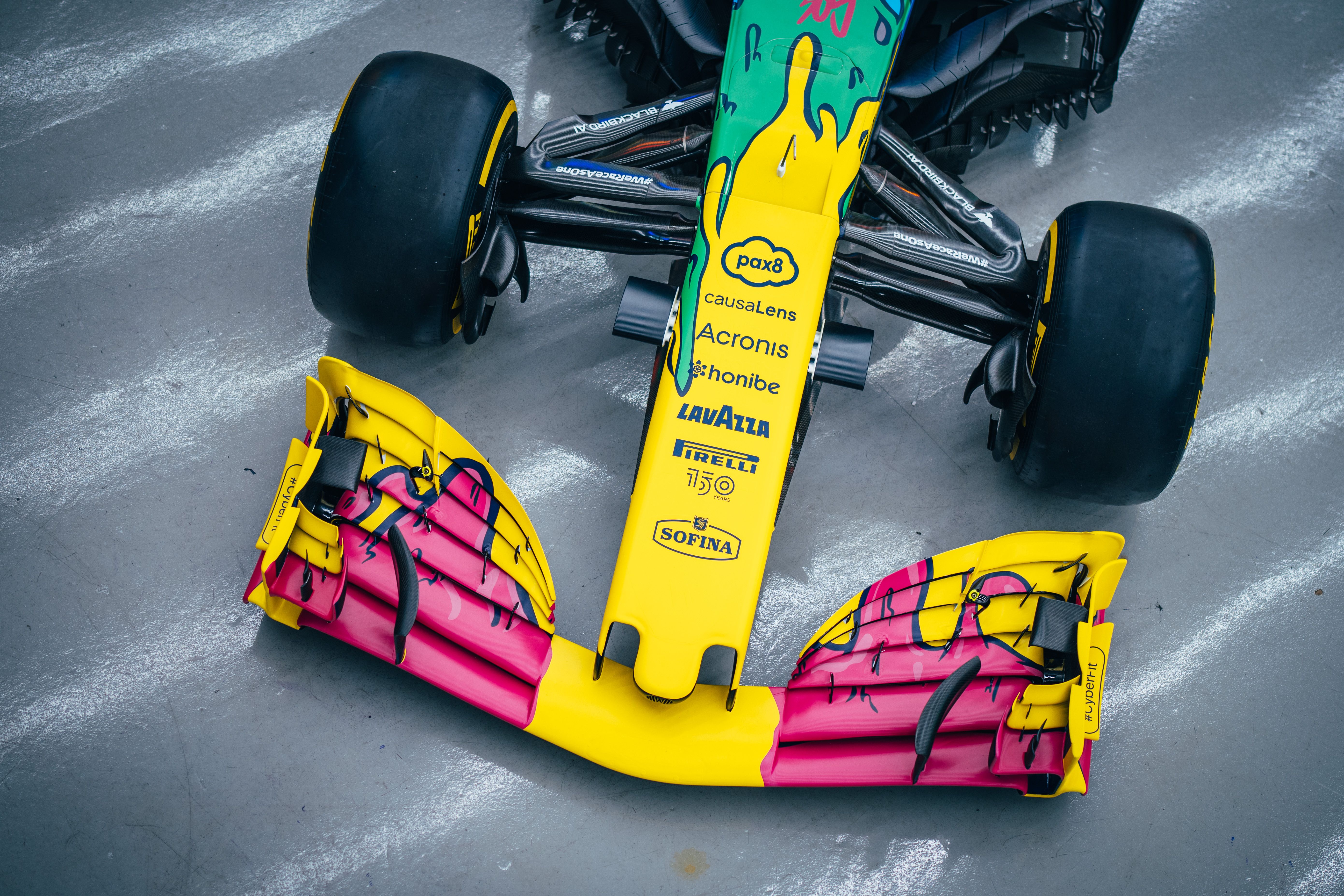 The pink flows over the yellow front wing as if pushed by the air