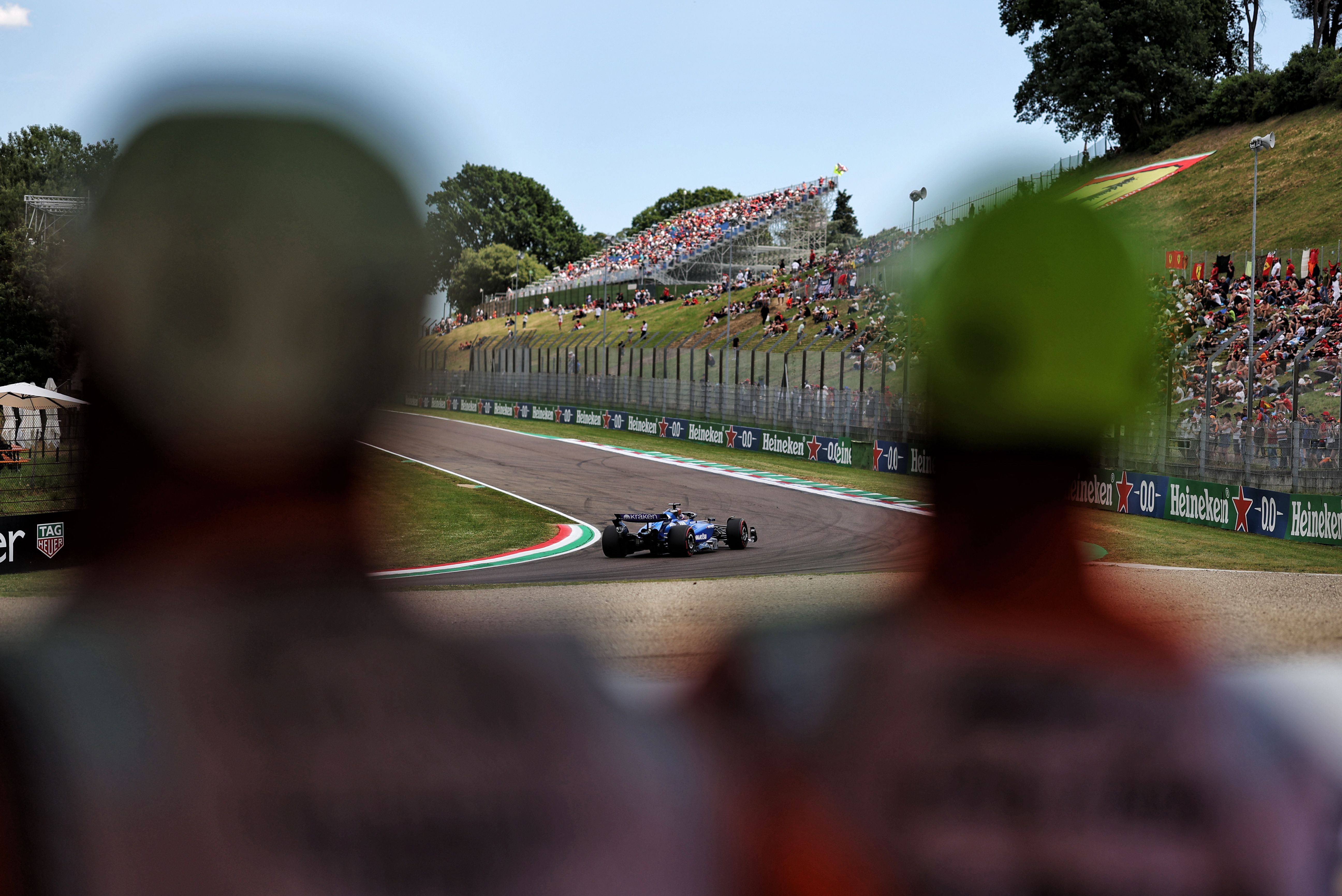 Two marshals look on as Alex corners Tosa