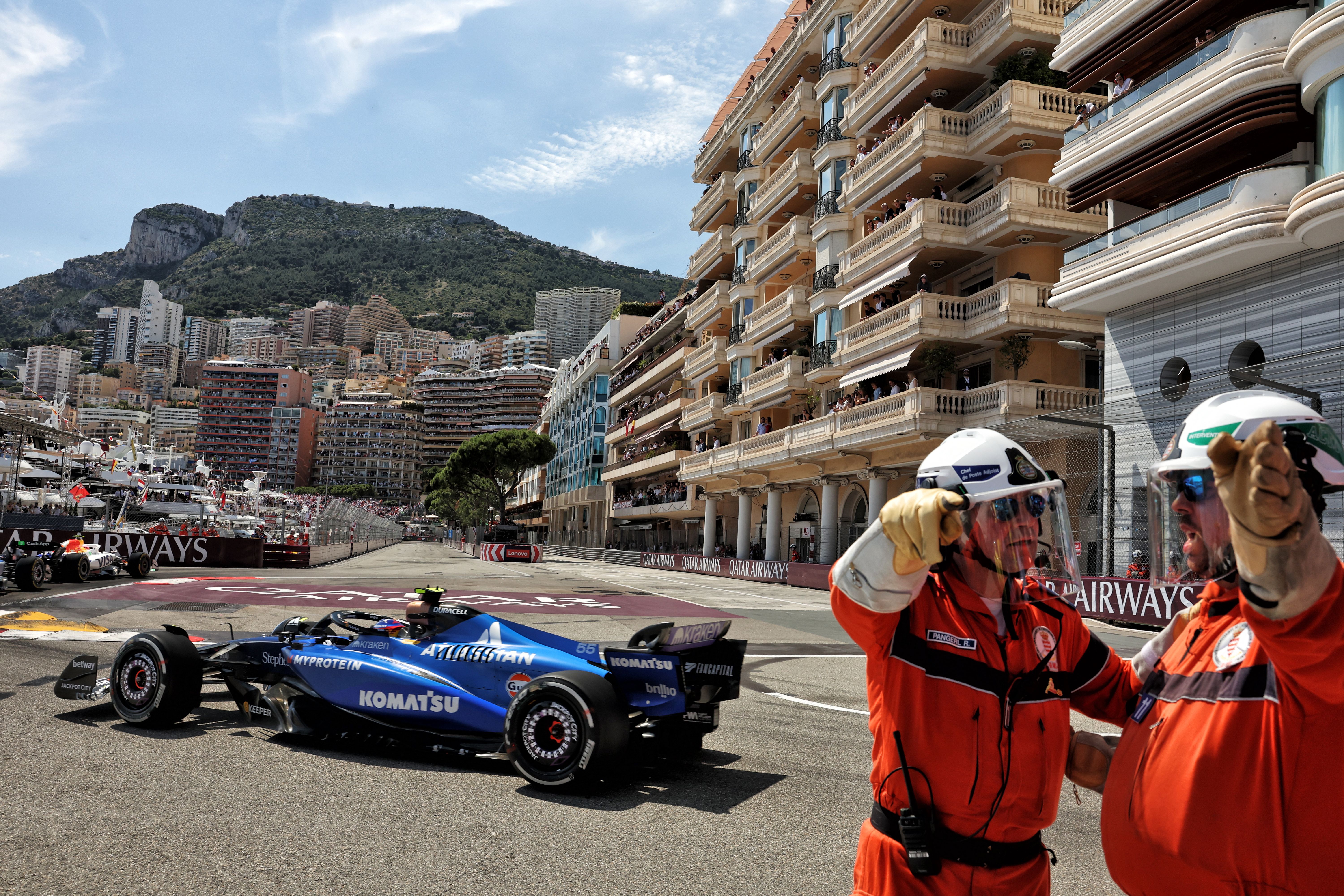 Two marshals gesture at the chicane