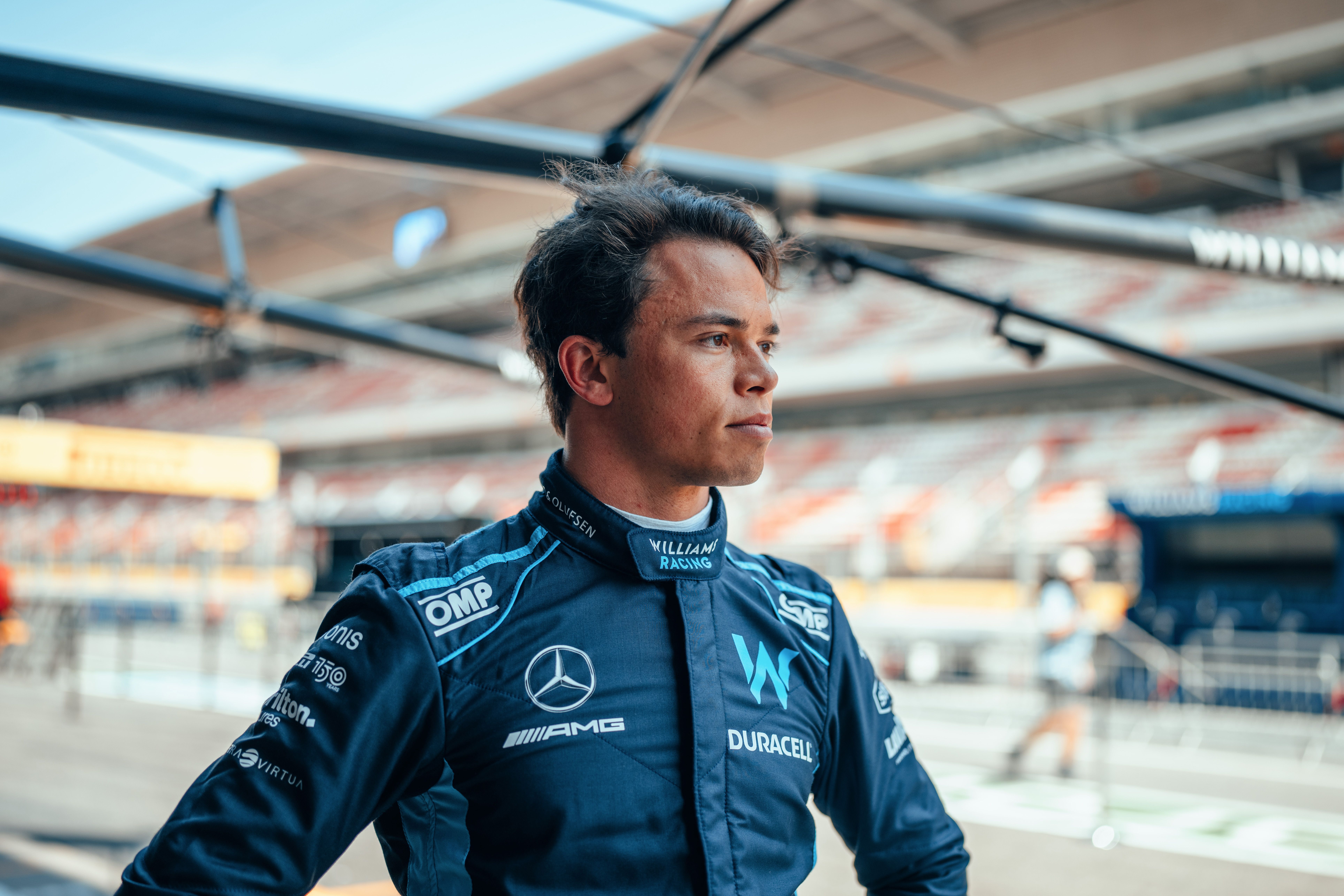 Trying on his fresh suit for the occasion