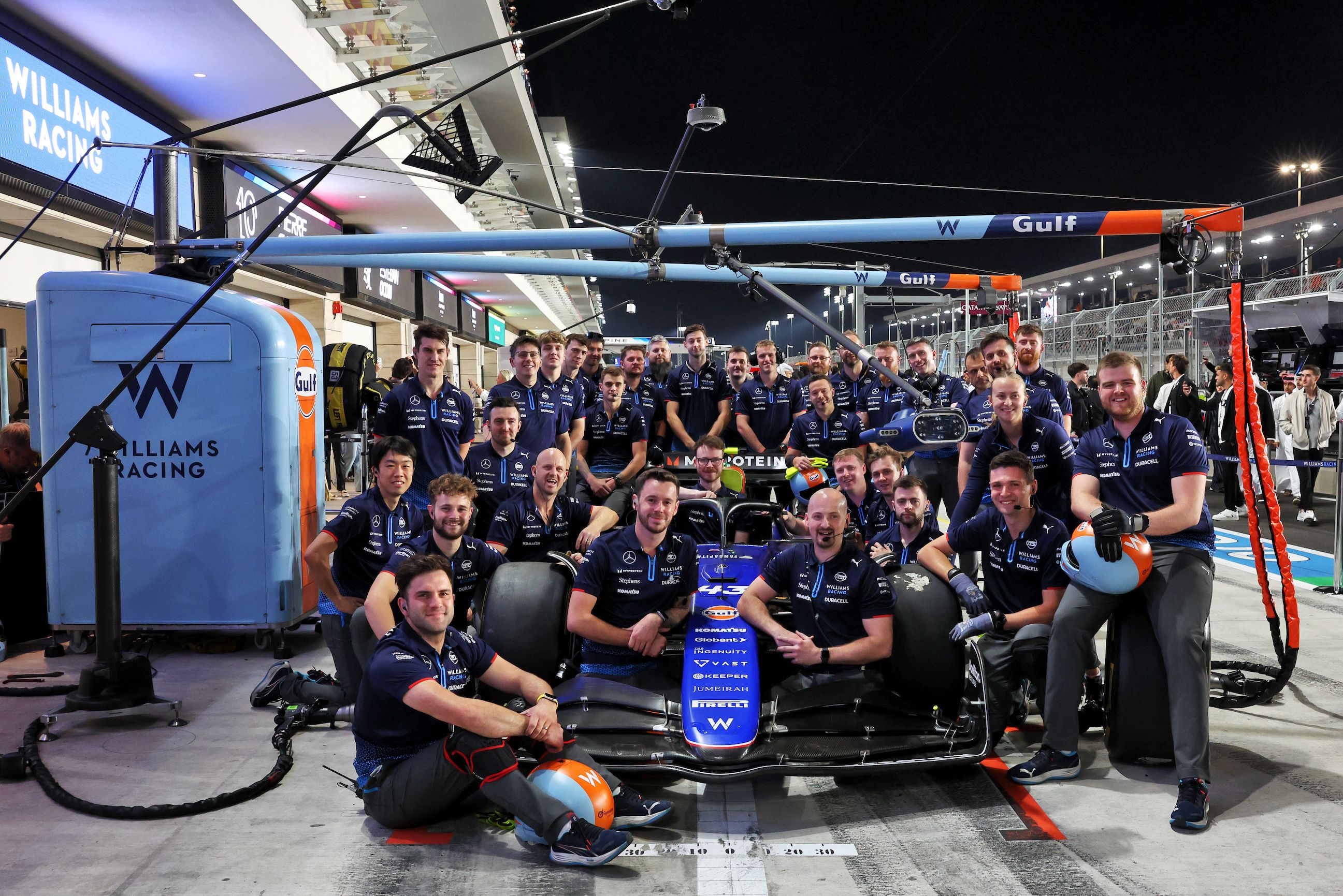 A group photo of the hardest-working crew in the paddock.