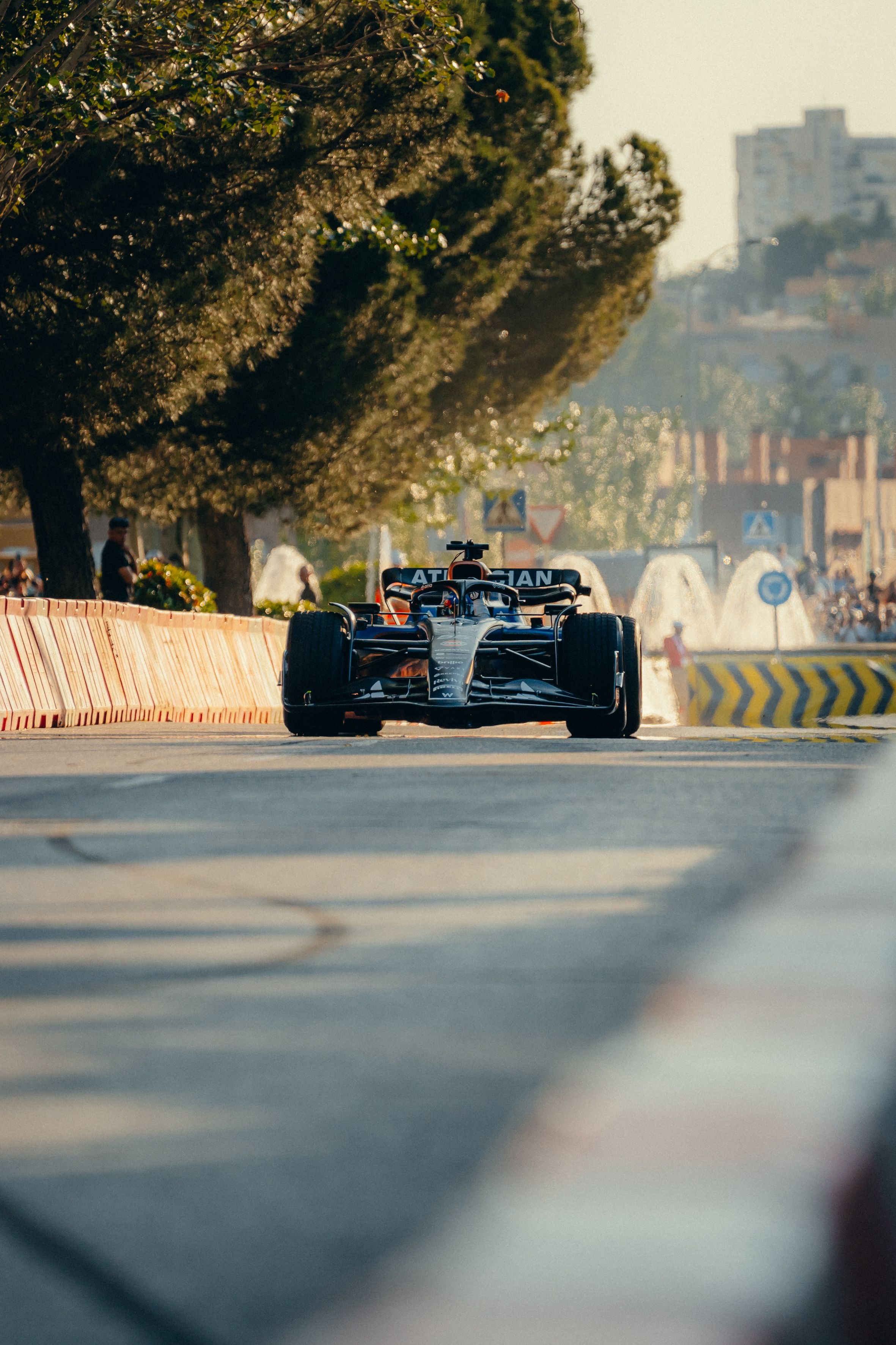 Speeding past the spectators.