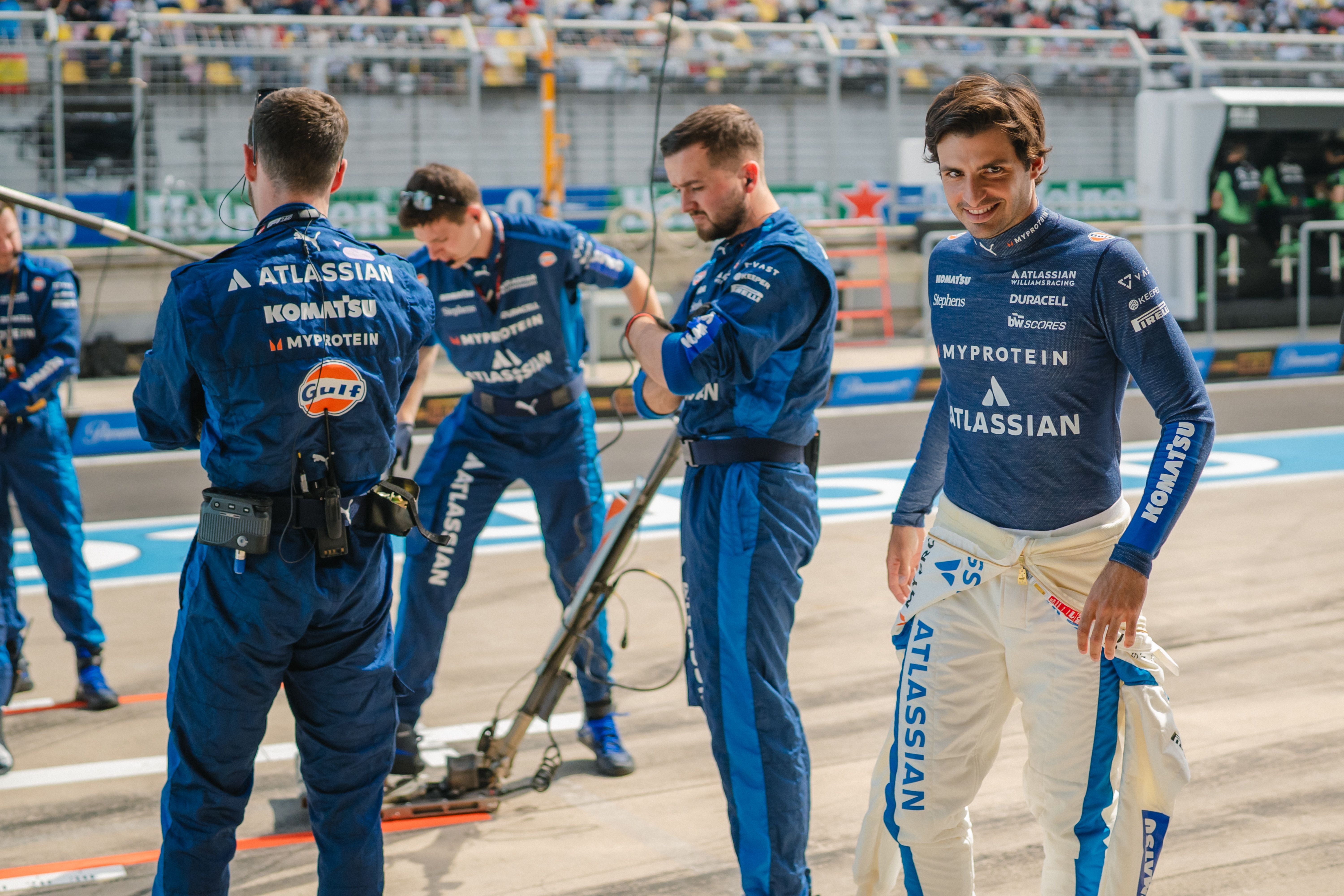 A smile for Carlos as he prepares to jump in the FW47