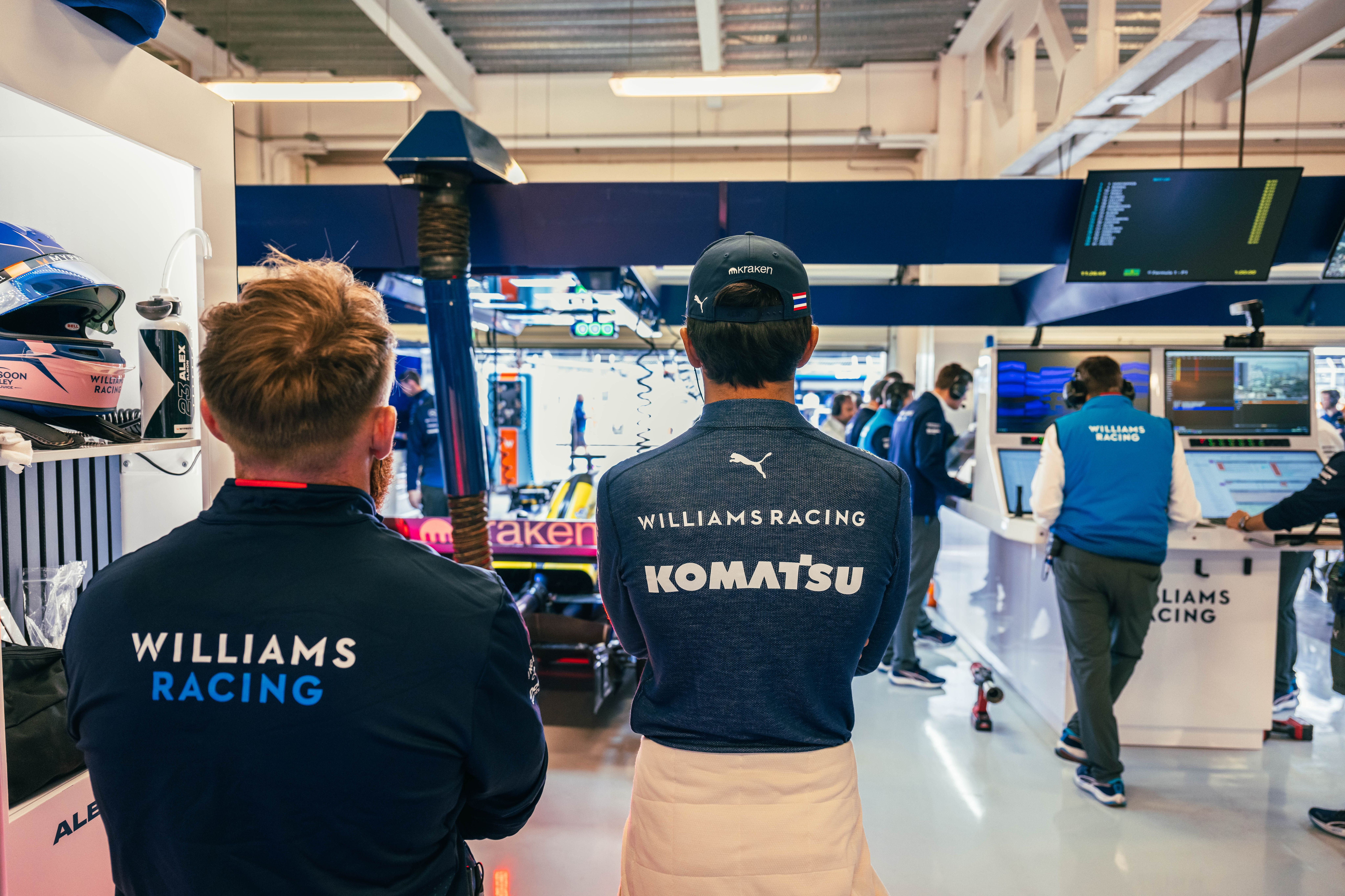 Alex watches on after the mechanics repaired his car