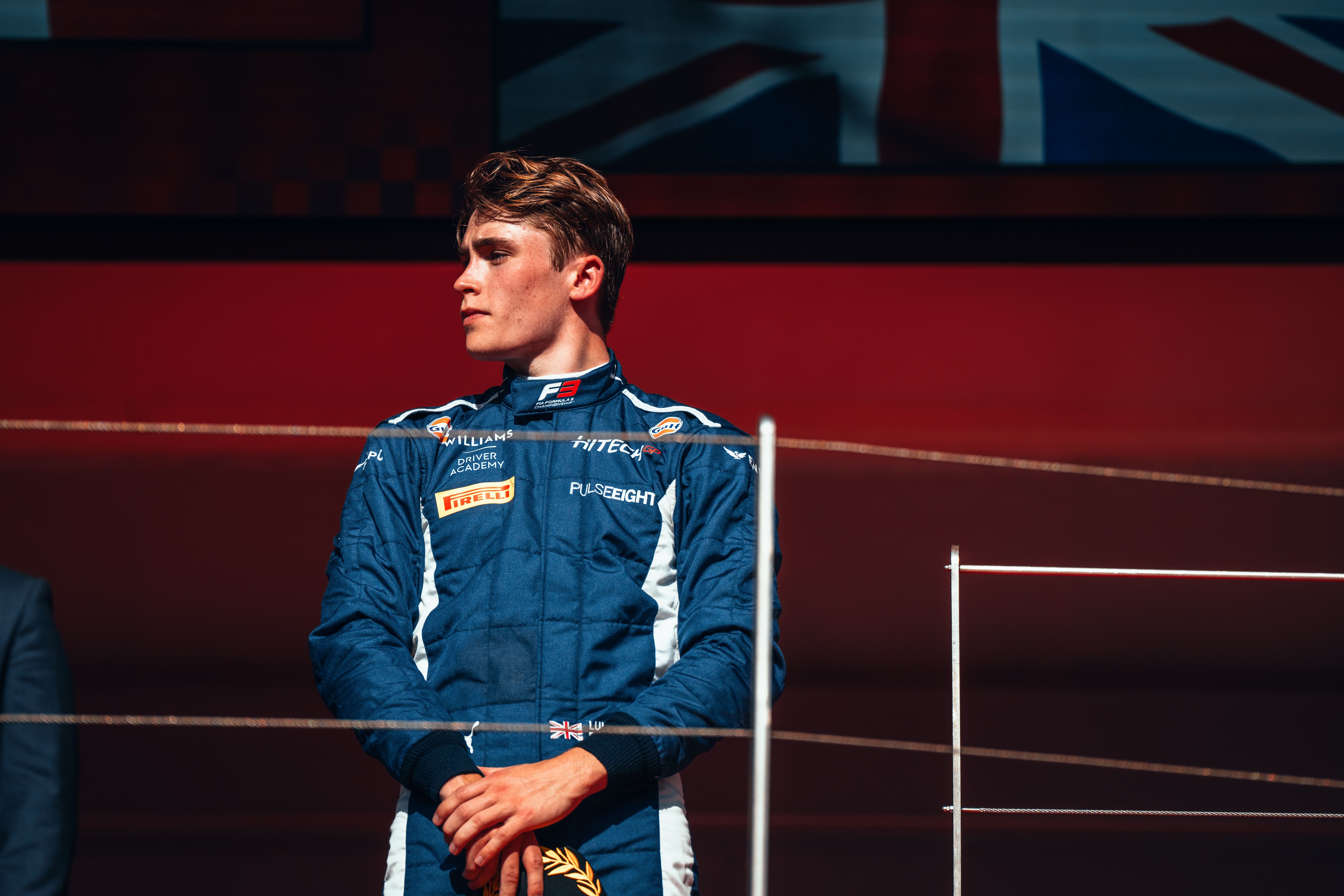 Luke Browning stands on the famous Monaco podium after his P3 in F3