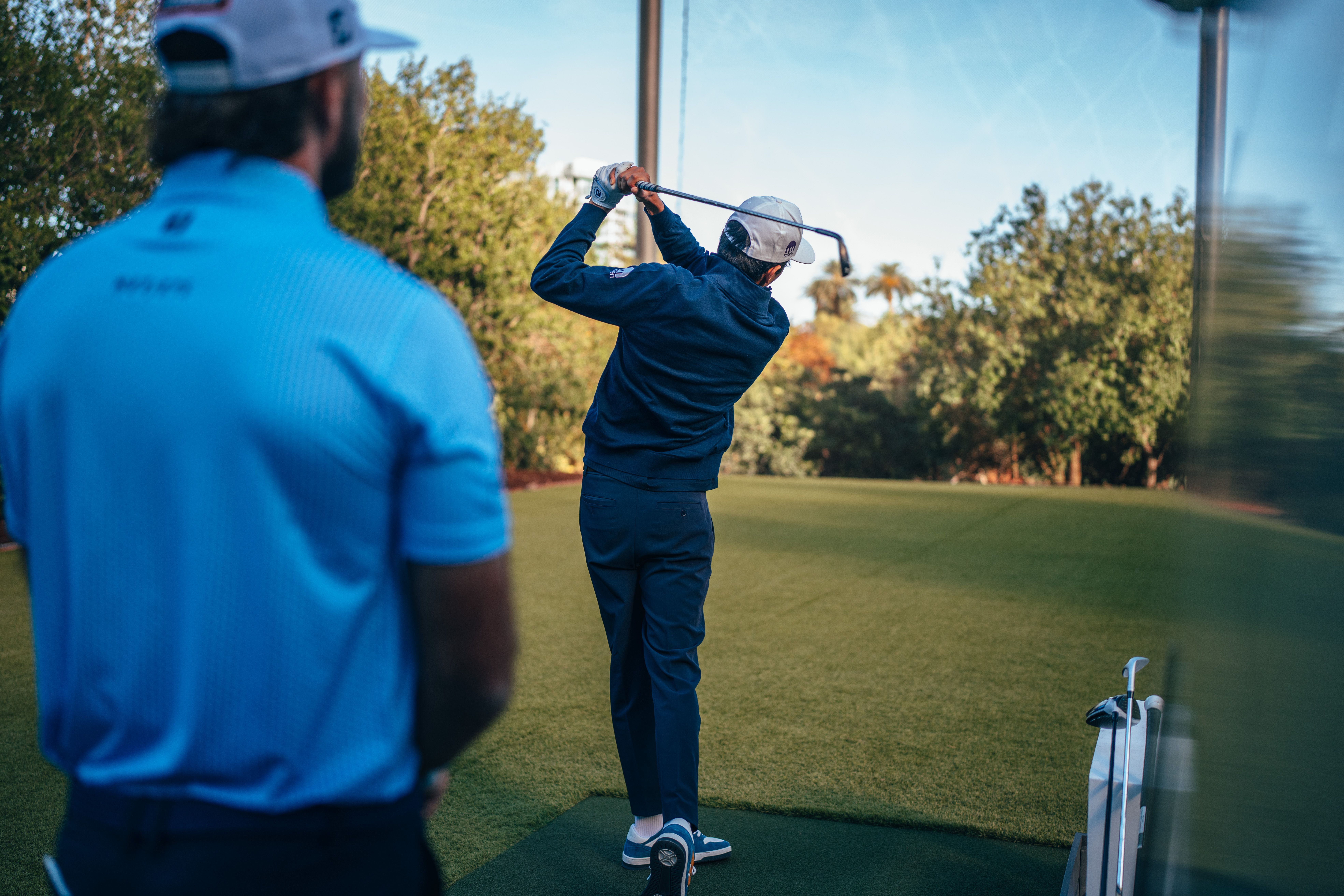 Keeping an eye on him at the range.