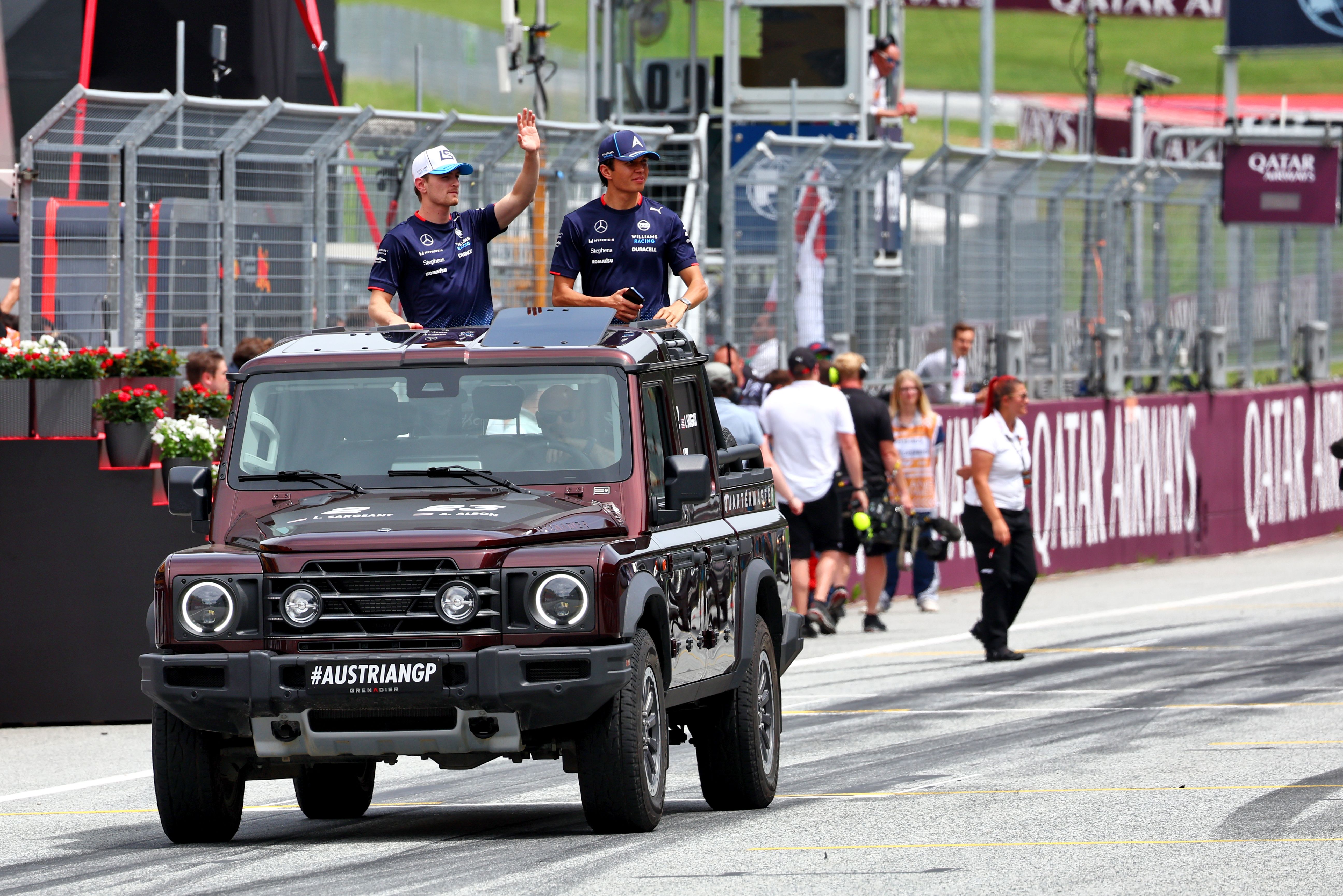 Our driver duo waving to the Austria crowd!