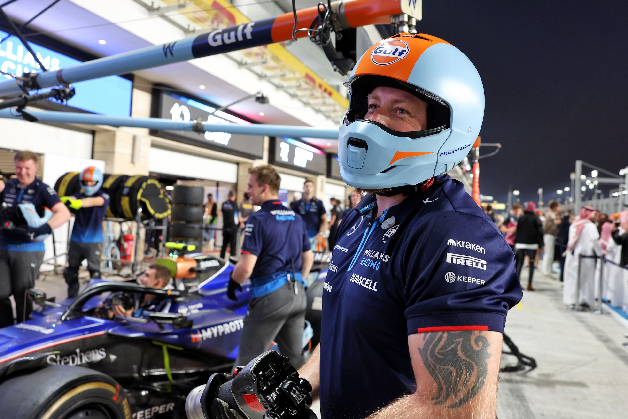 The pit crew getting some pre-race drills in.