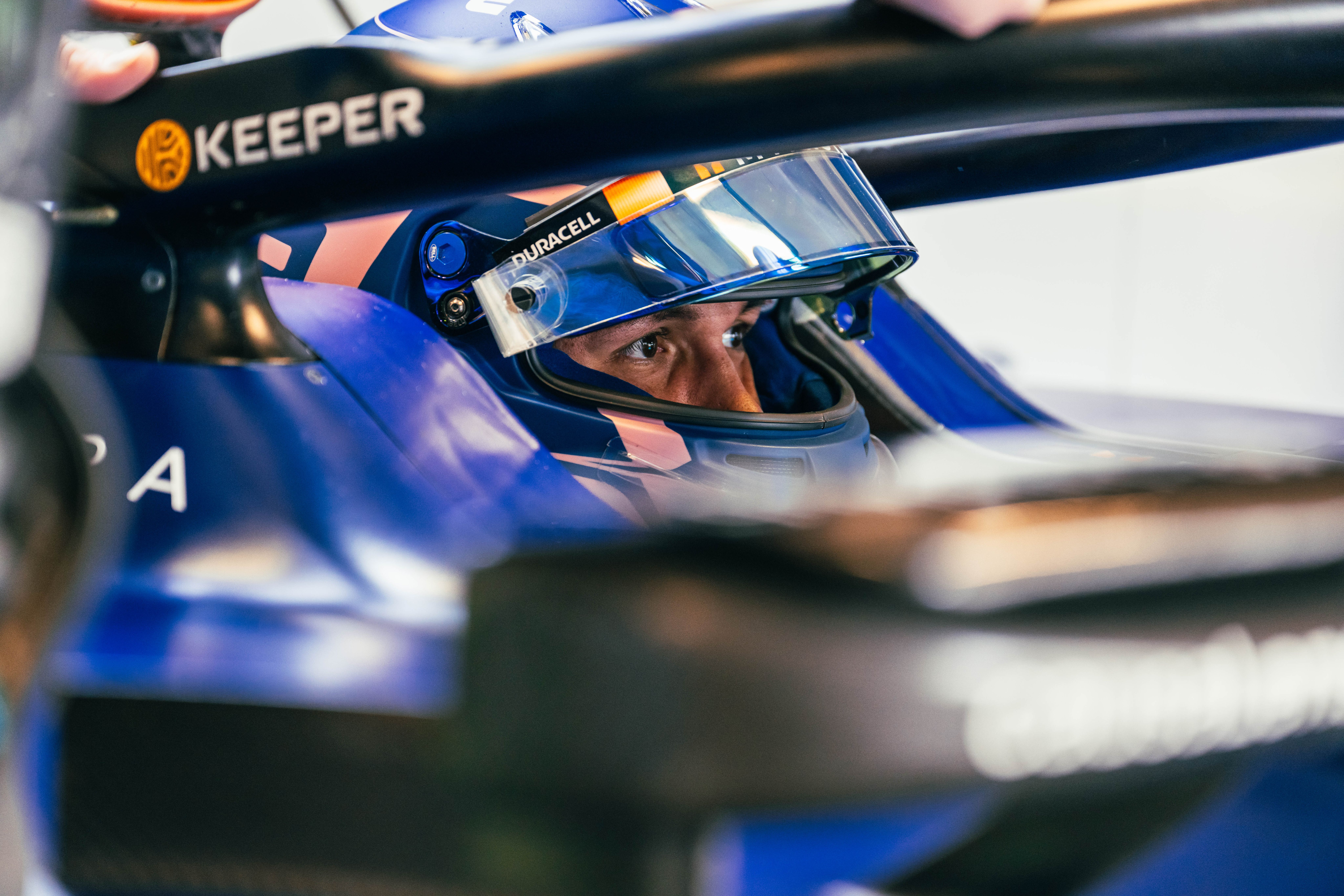 Alex peers out of his cockpit