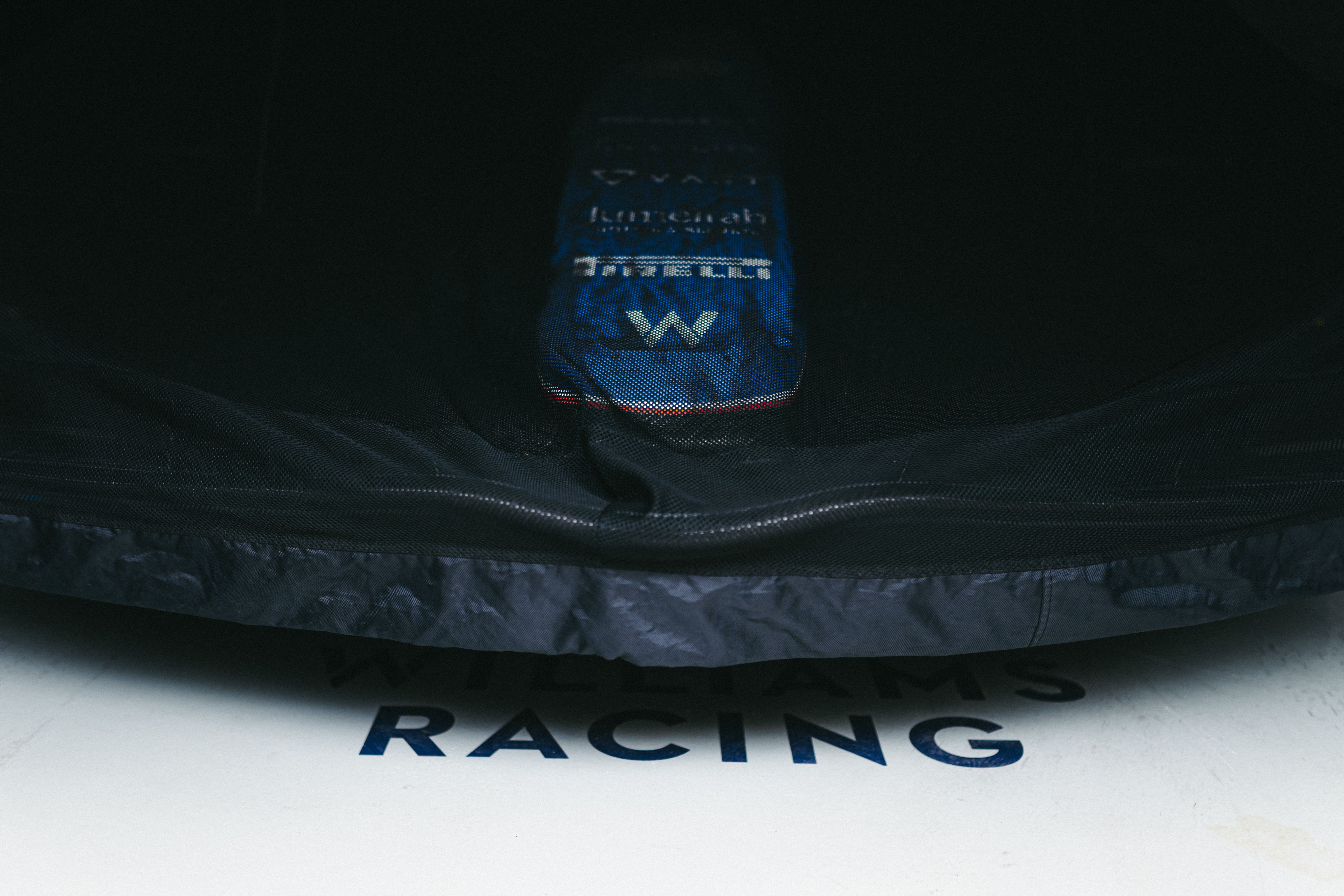 The FW46 sat under the covers before race day.