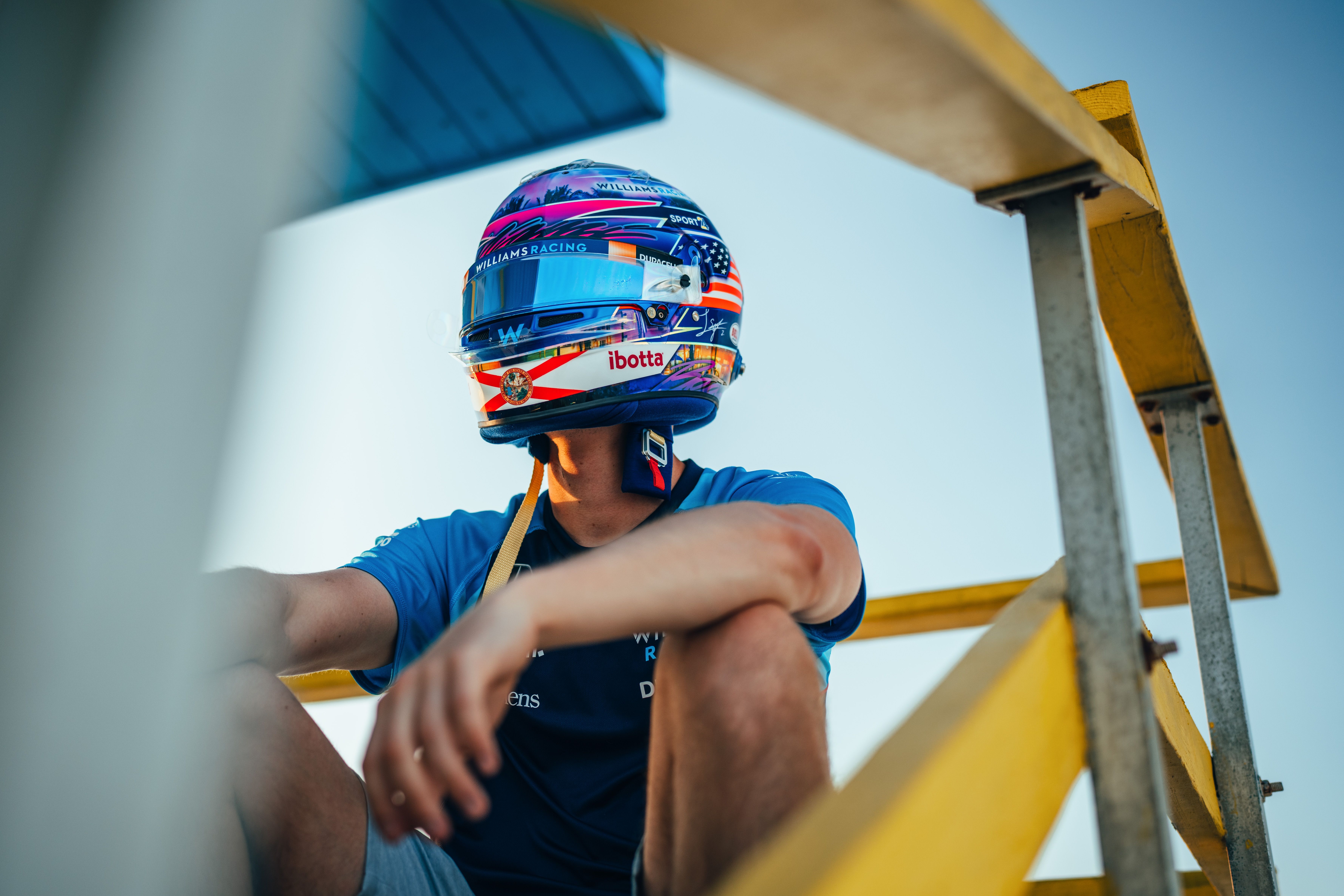 The state flag of Florida features on the chin.