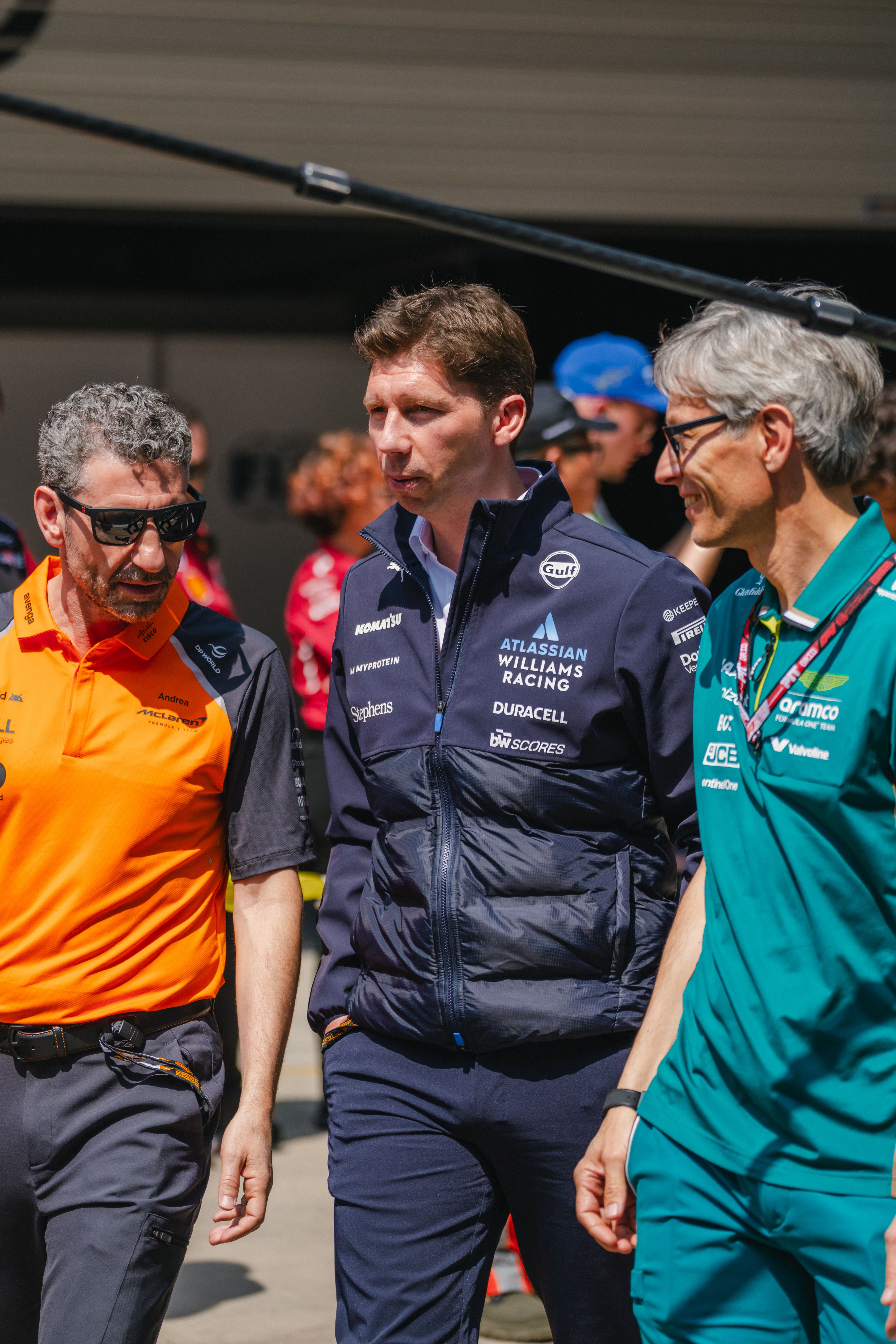 James and his fellow team leaders walk down the pit lane