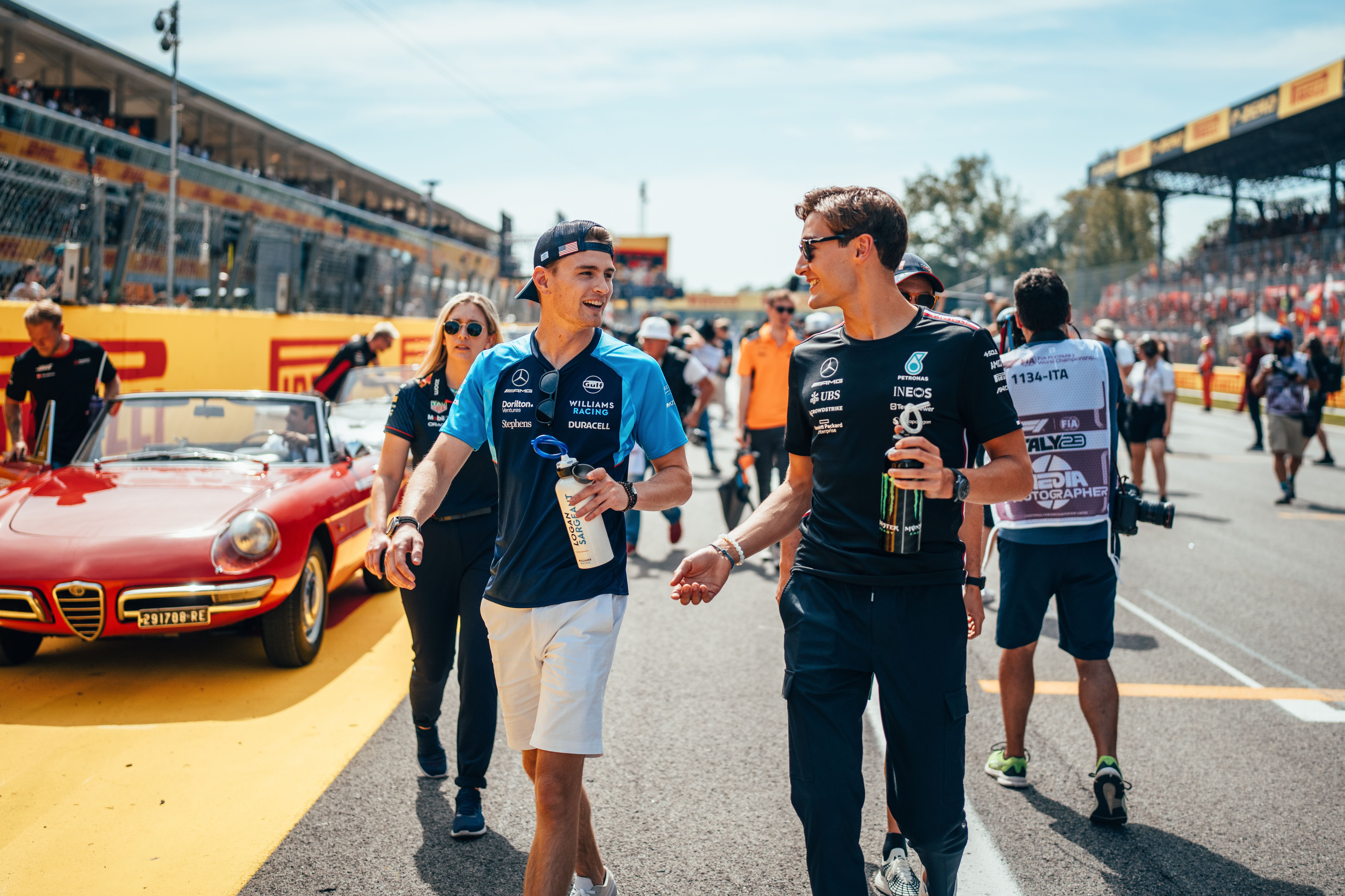 Logan and Goerge Russell catch up before the drivers’ parade.