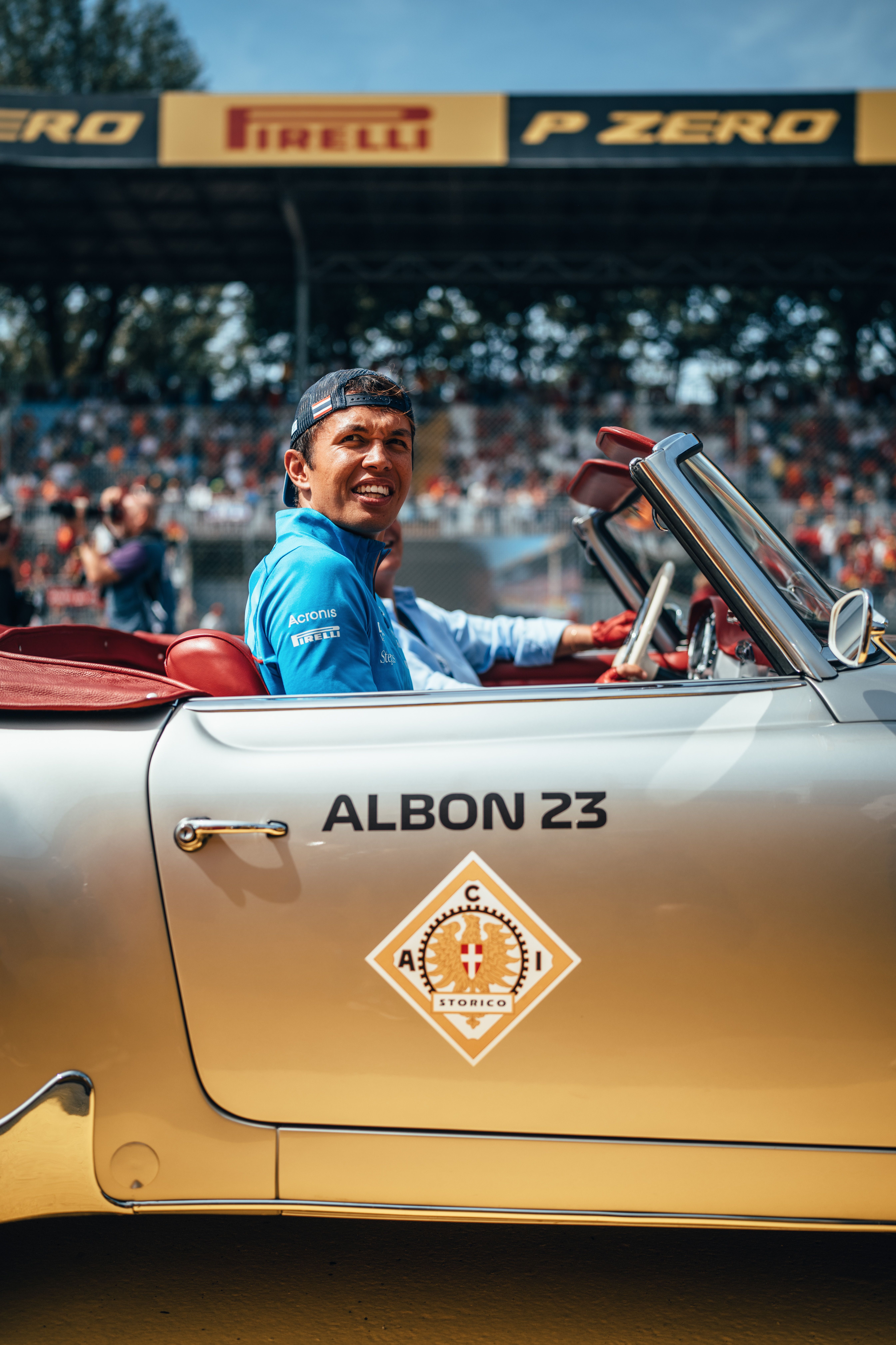 Smiles for Albono as he prepares for a passenger-side tour of Monza.