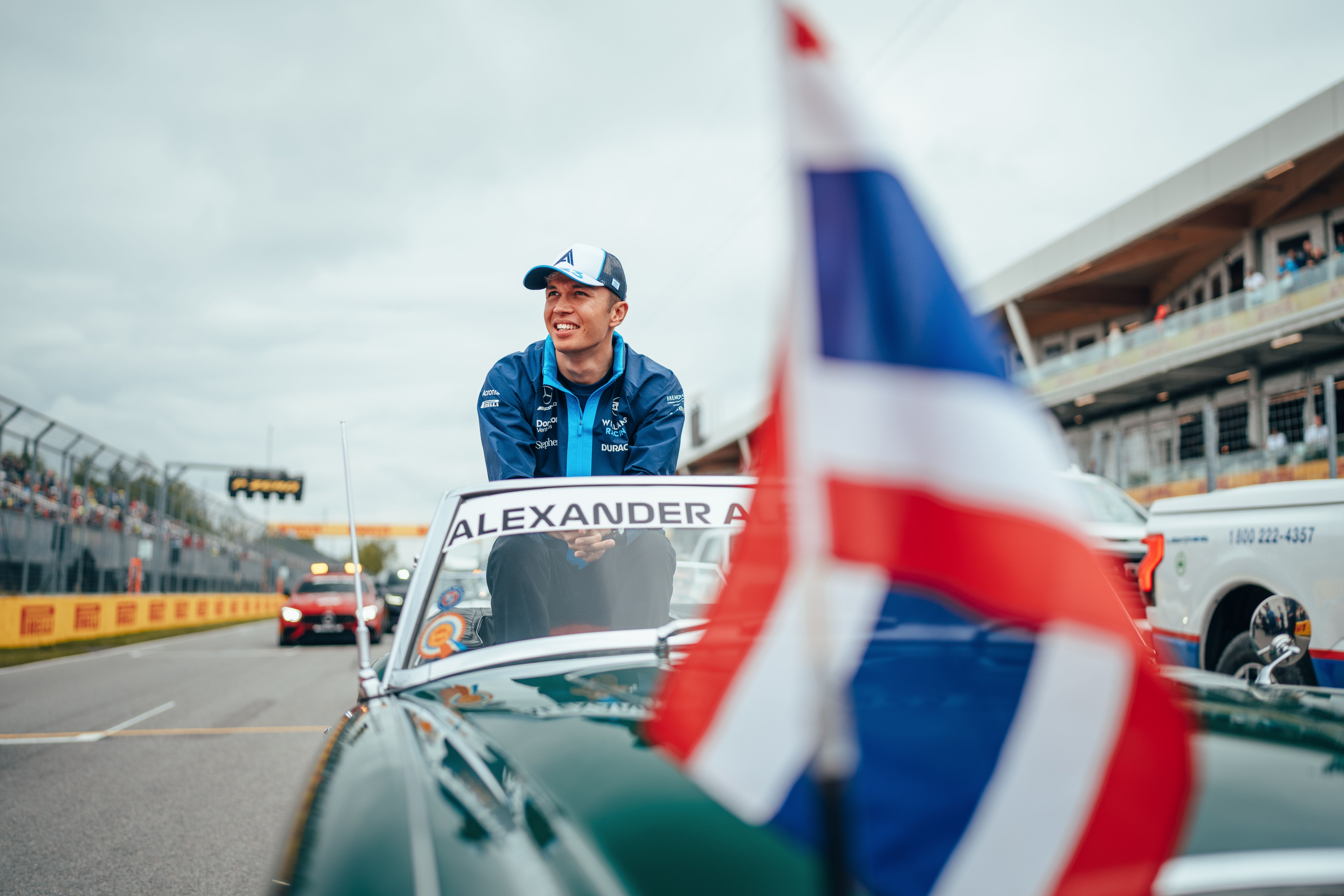 Braced for his first lap of the day on the Drivers Parade.