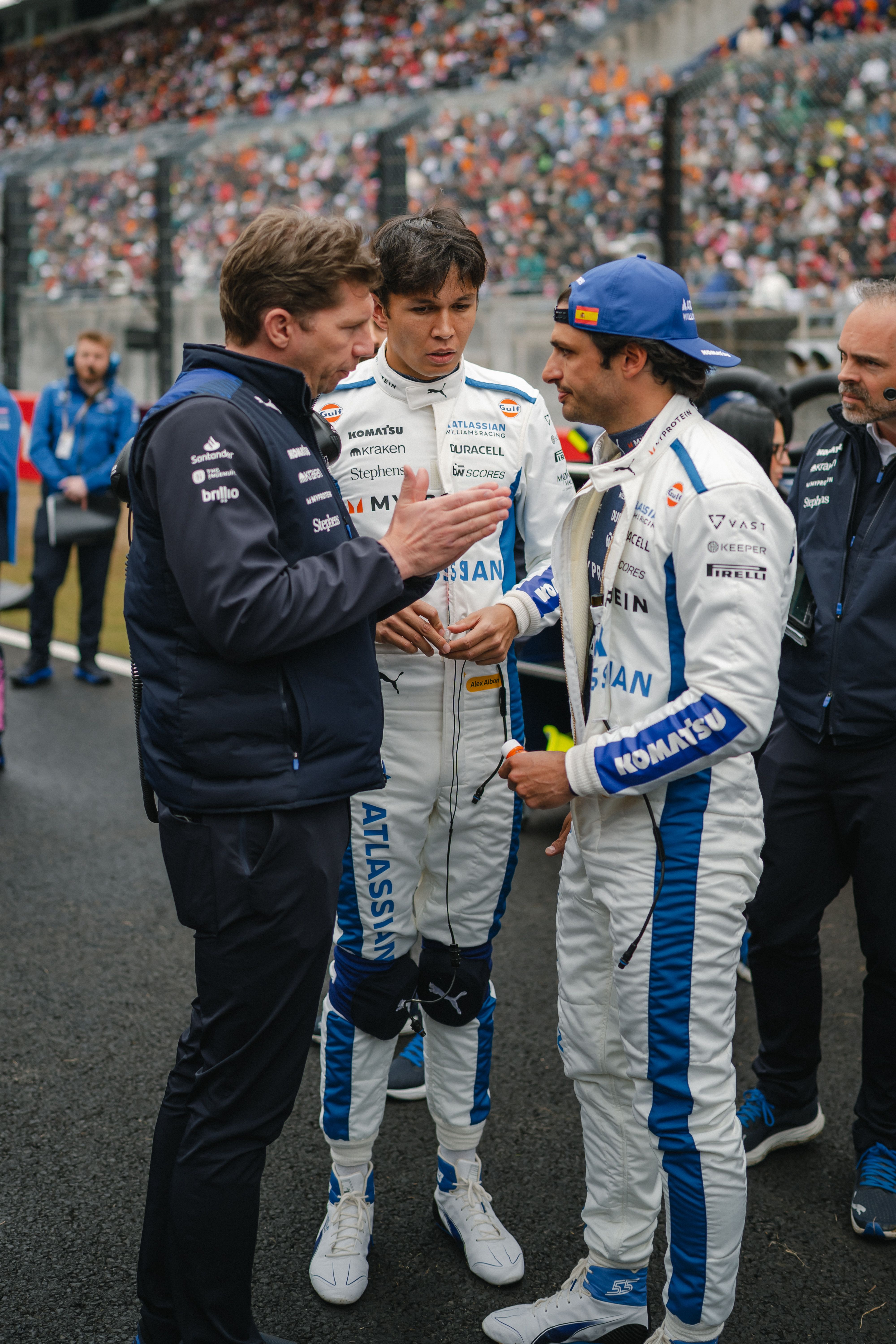 James speaks to his drivers before the race begins