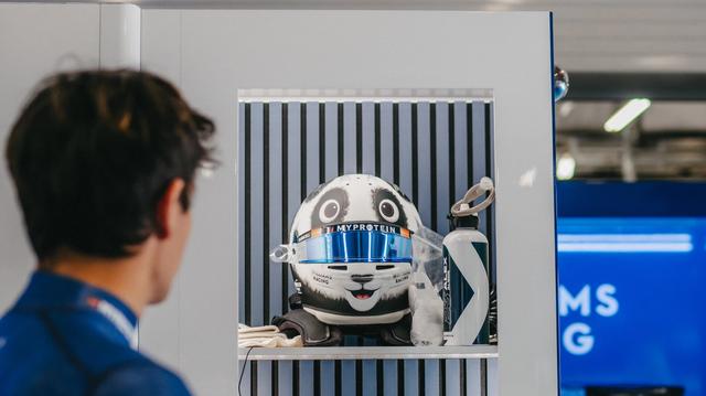 Alex looks at his new lid for the weekend.