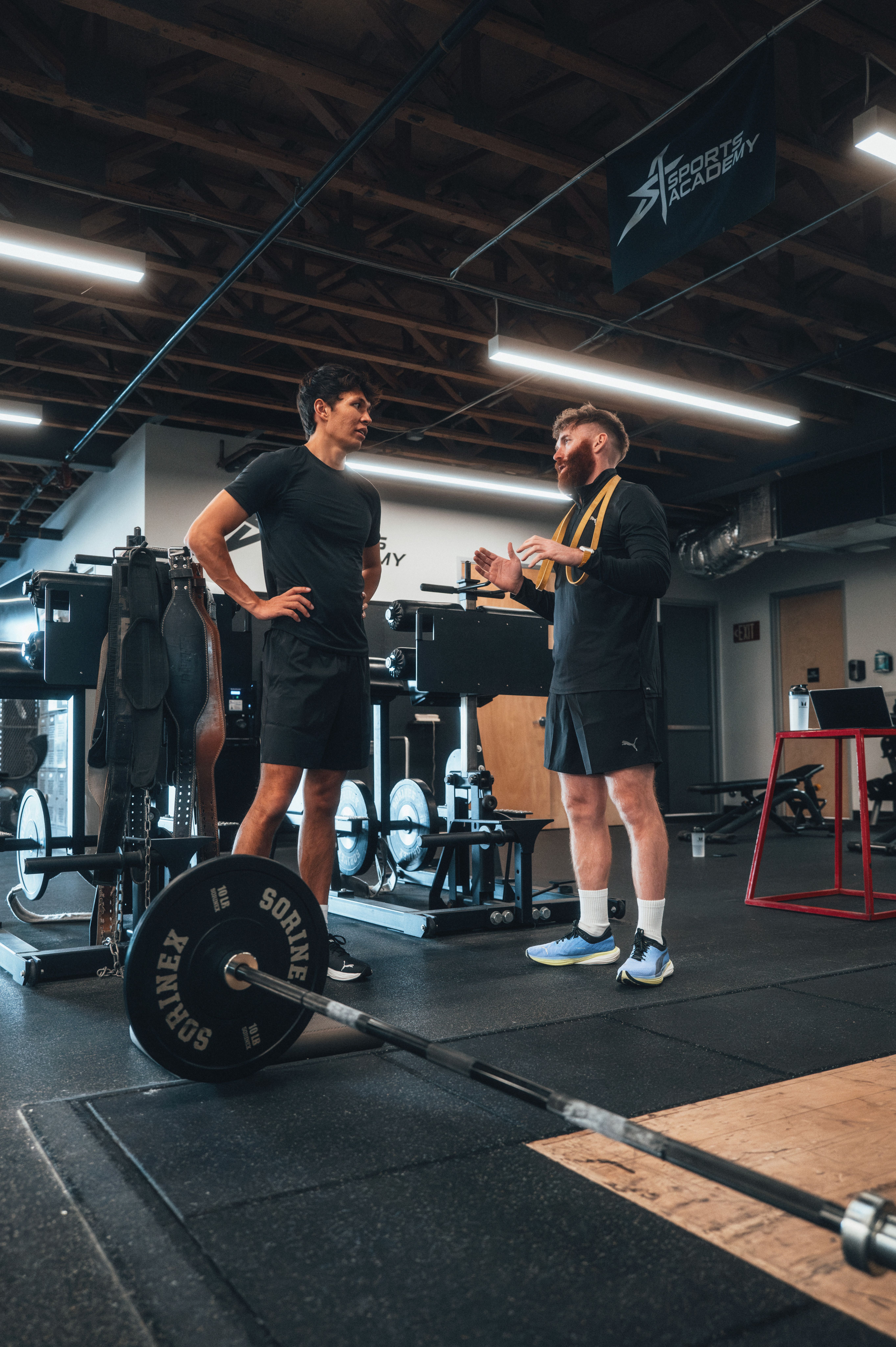 Patrick guides Alex through the next task.