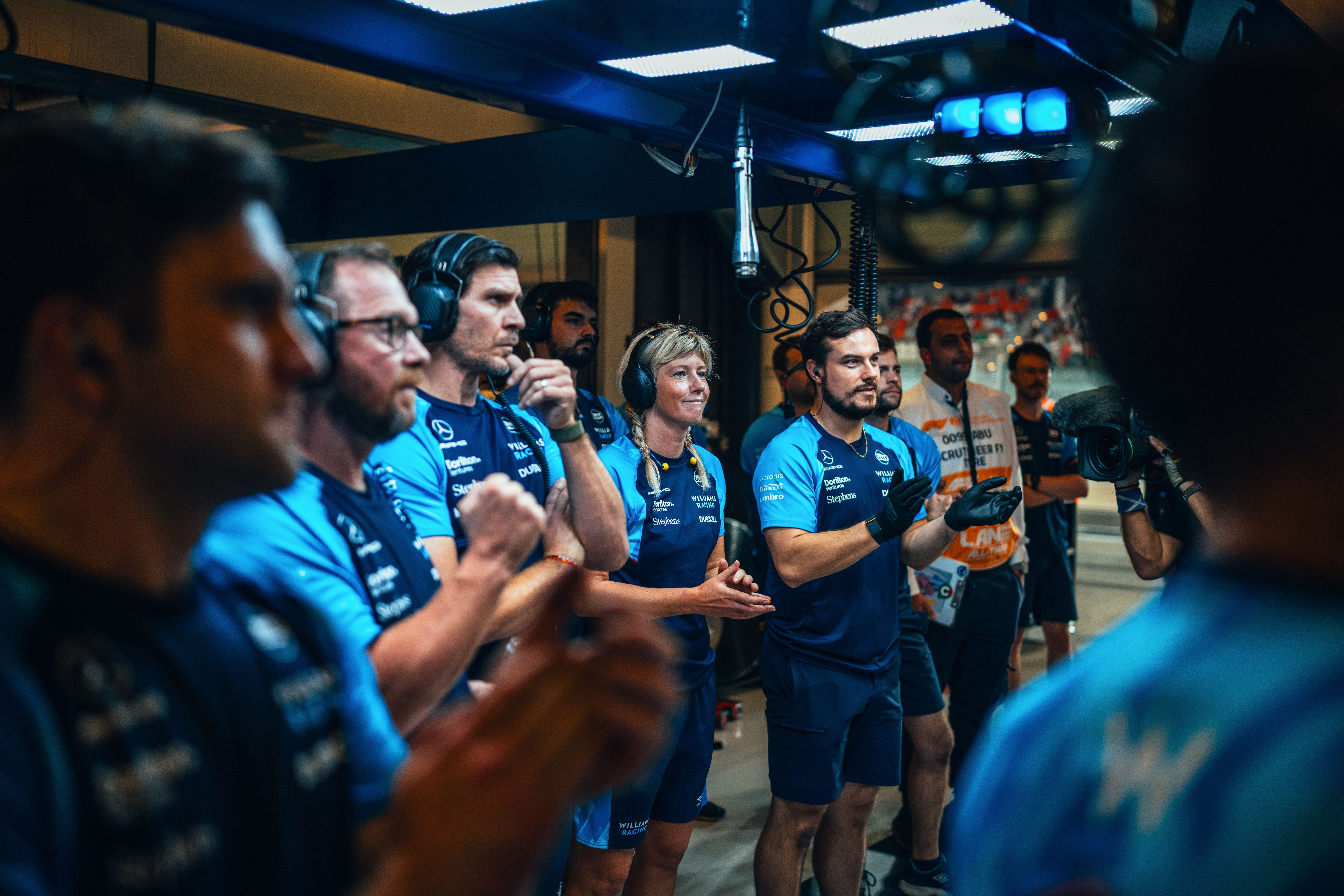 The pit crew react to Logan’s speedy times before the unfortunate lap deletions.