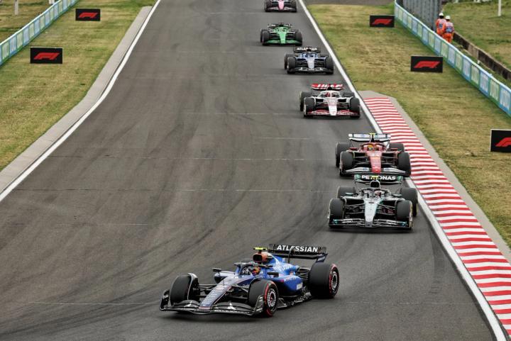 Carlos Sainz and Alex Albon in a train of cars at the 2025 Hungarian GP