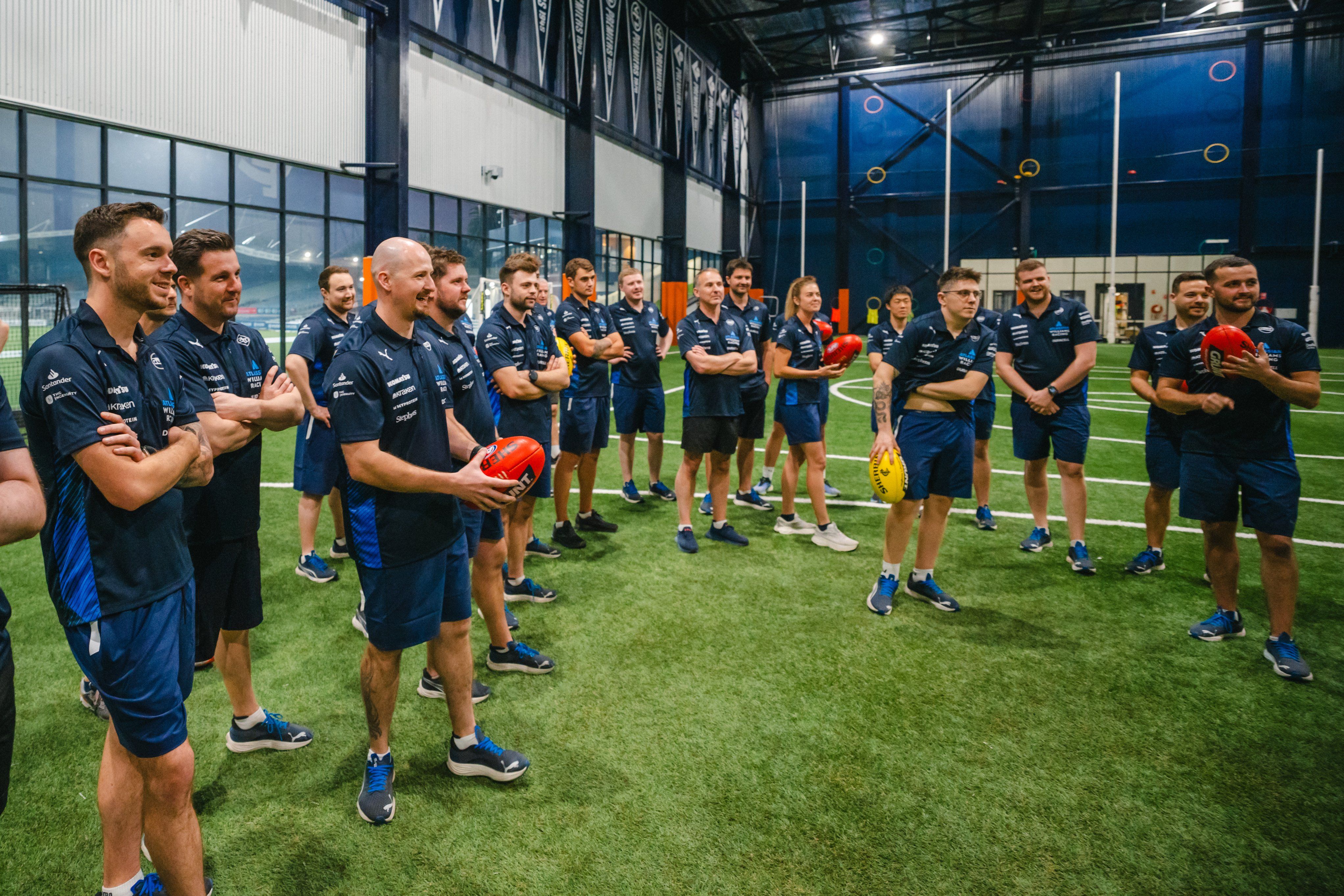 Getting to grips with Aussie Rules Football.